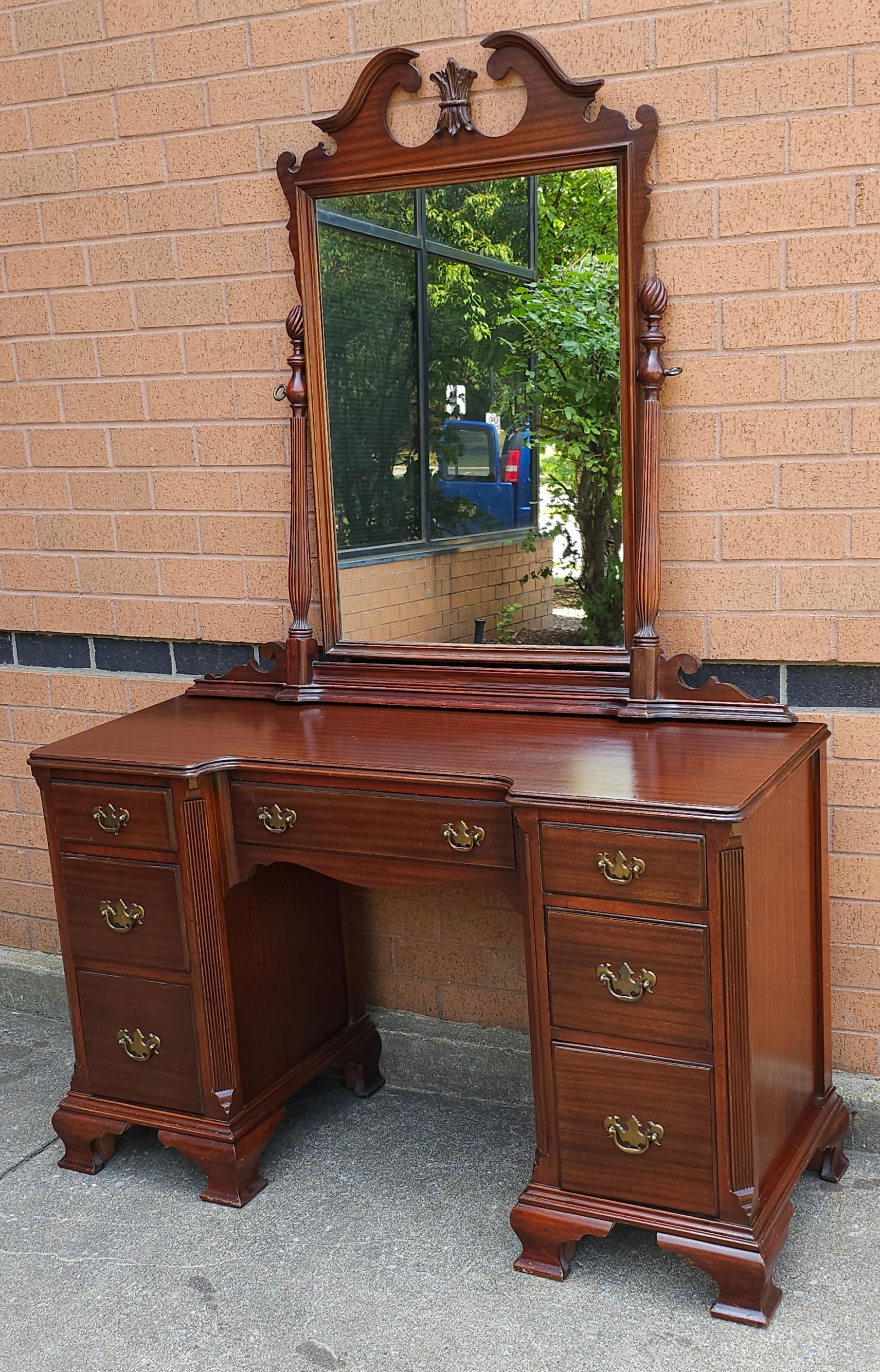 A Mid-Century Chippendale Style Mahogany Vanity Table with Mirror in very good vintage condition. Measures 48