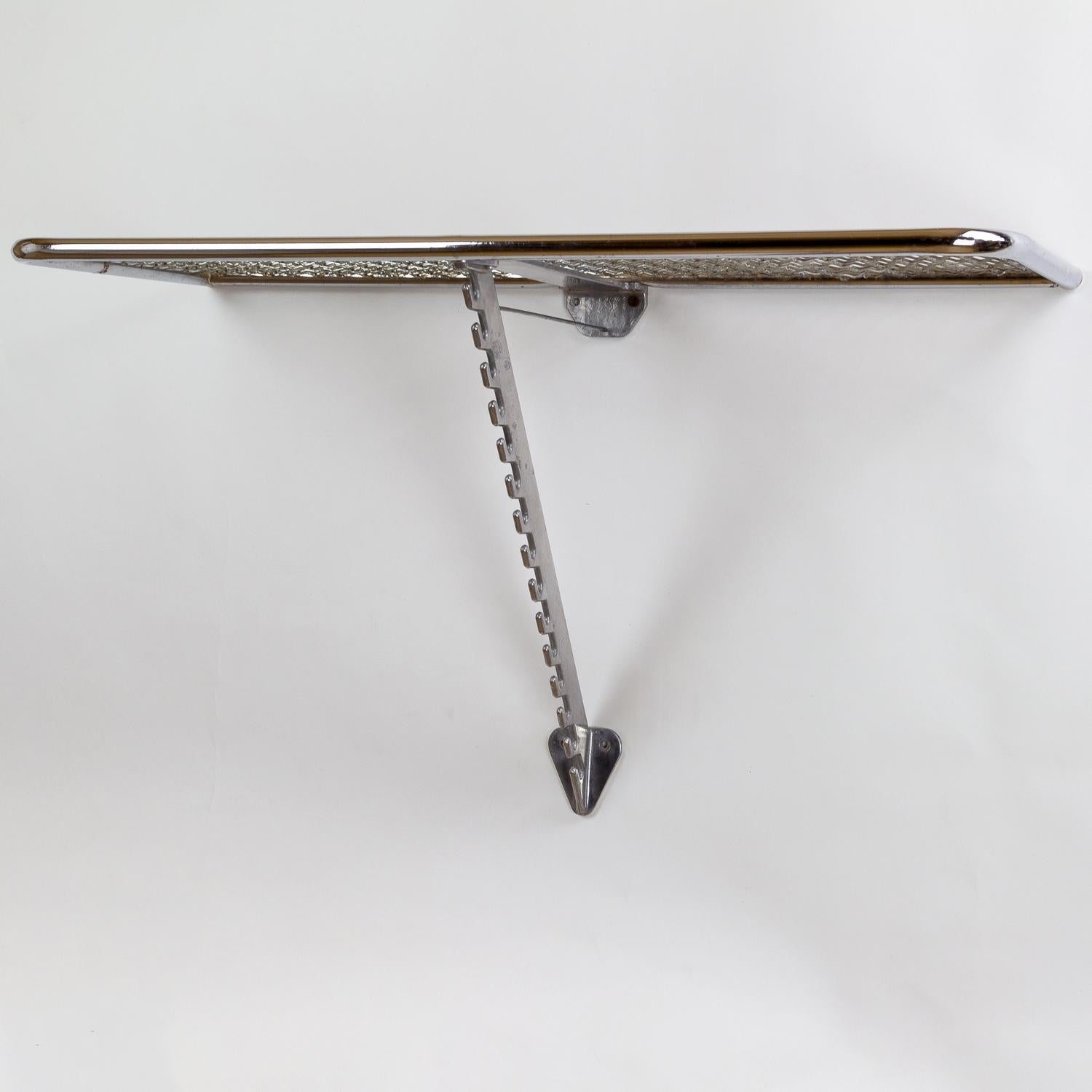 An unusual chrome, aluminium and mesh coat and hat rack from Denmark, circa 1950s. Great patina.

  