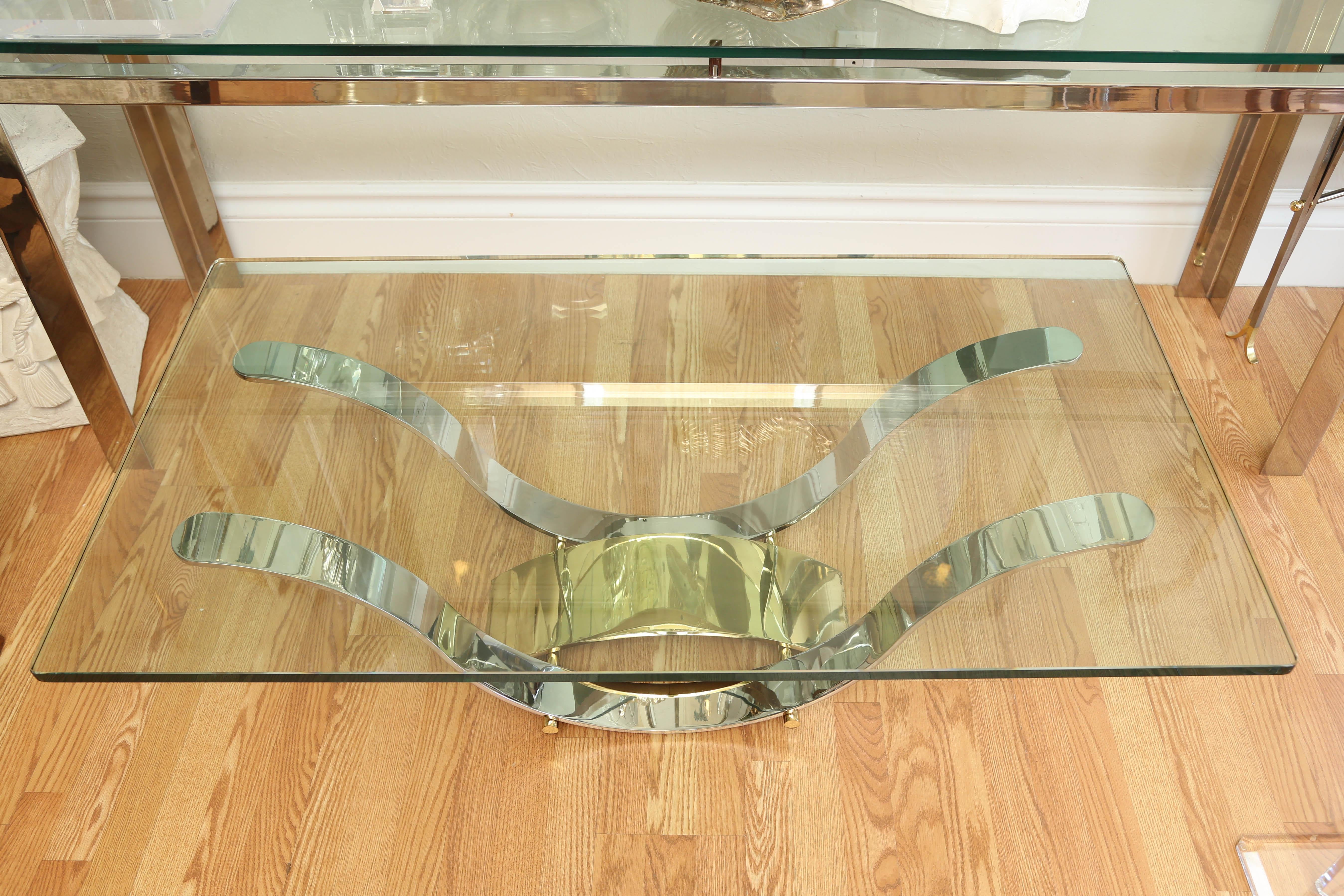 Chrome and brass cocktail table base with glass top in the style of Karl Springer.
