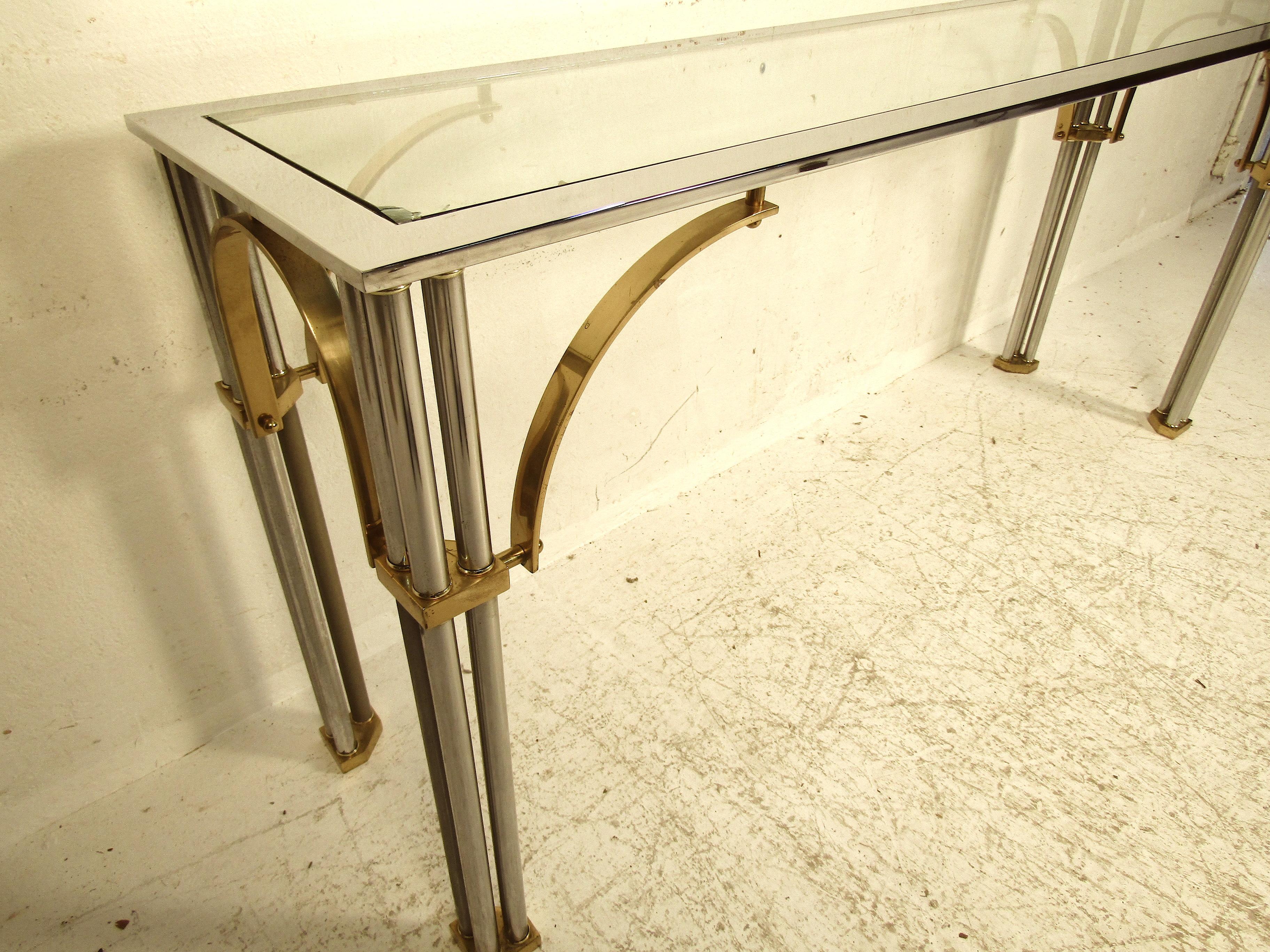 This elegant console table features clean lines and a simplistic style. It would make a great addition to any dining room or party room set up. Sturdy construction and heavy materials would make this a great addition for any high traffic area.