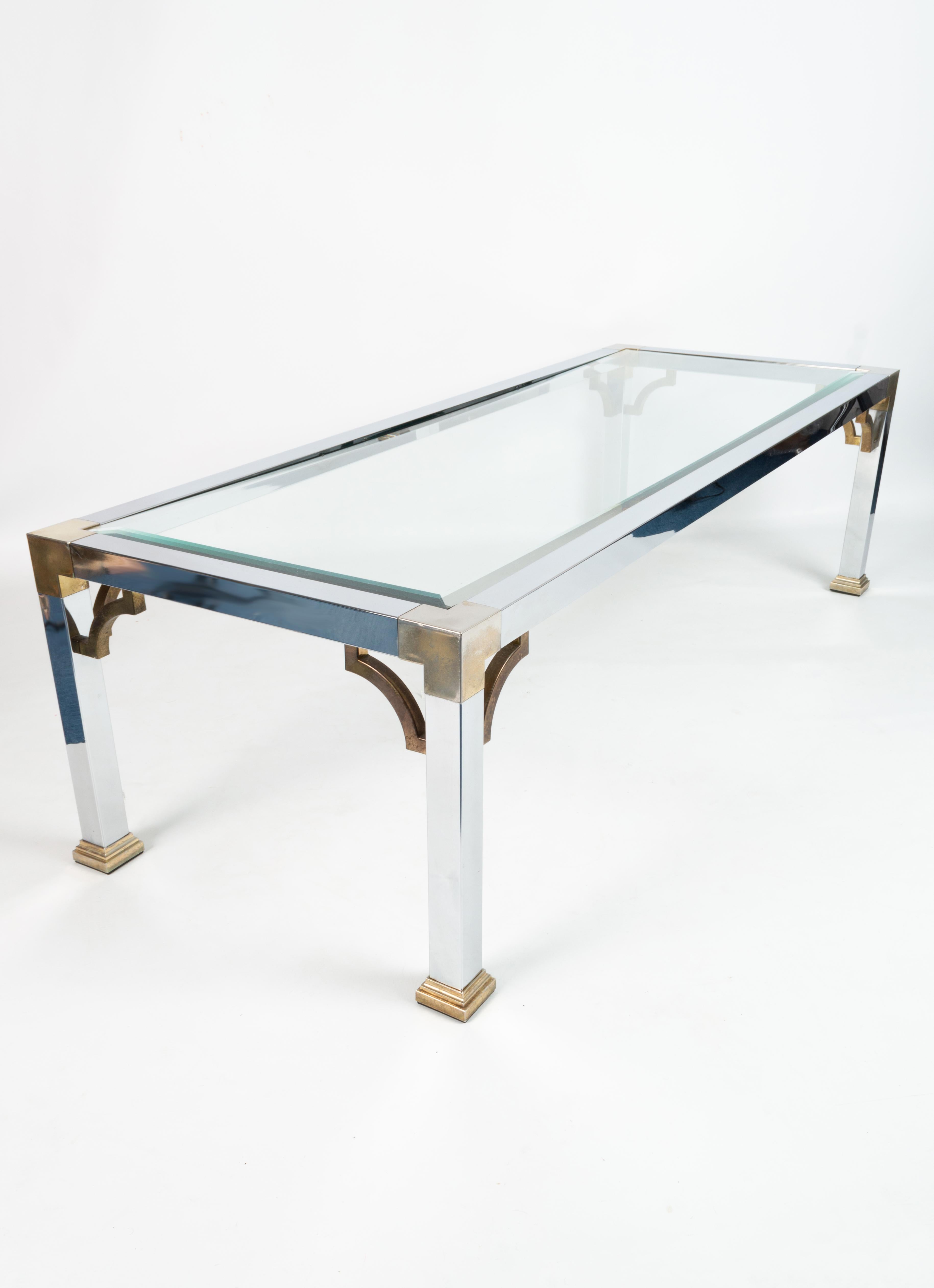 Mid-century chrome and brass long glass top coffee table, Italy C.1970.

In good vintage condition, commensurate with age. Some wear to metal frame, and fleabite to one corner of glass (not visible when in-situ). Please see last photo.

