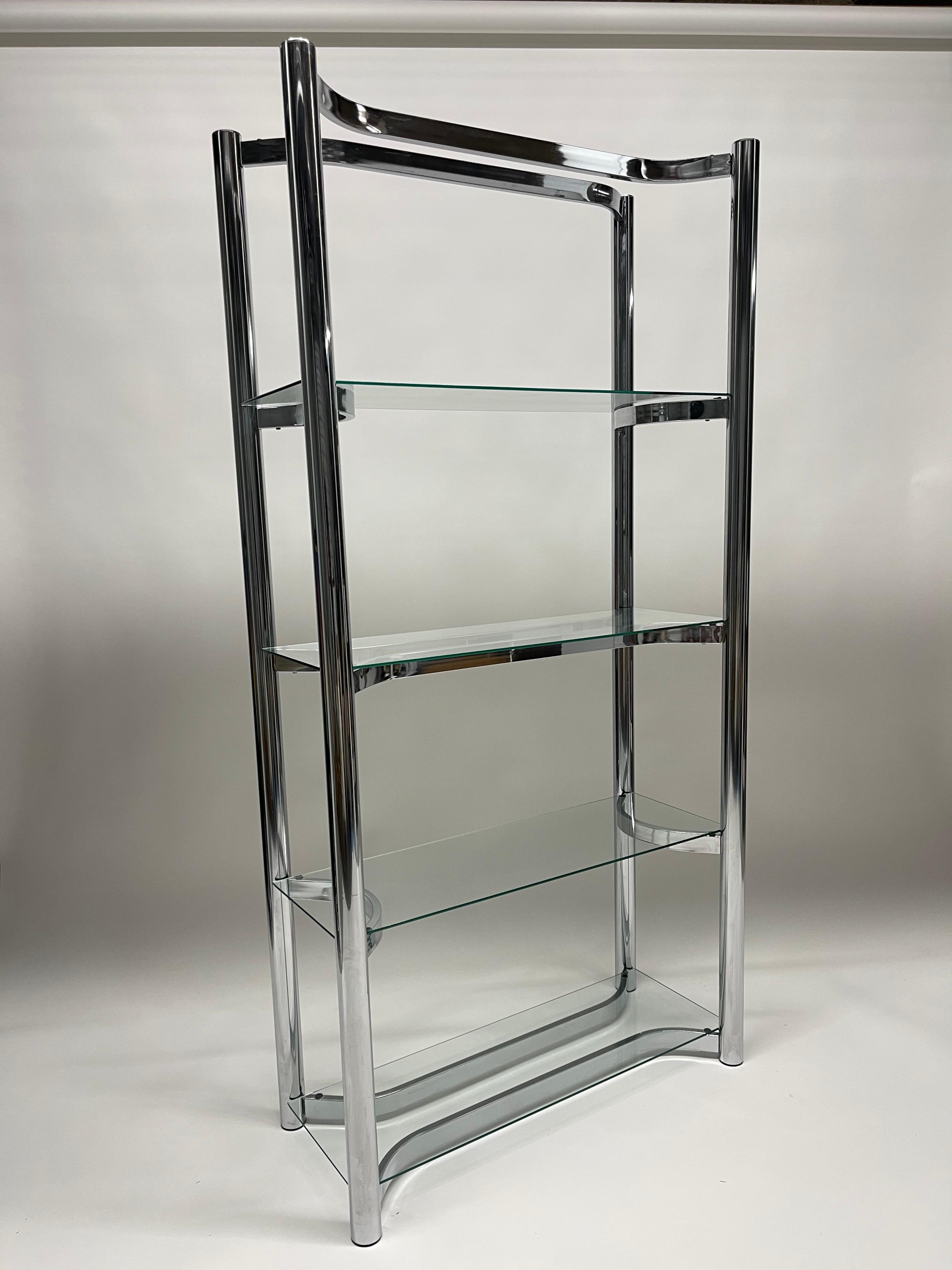 Mid-century etagere bookcase shelf rendered in chrome plated steel frame with glass shelves, Finished on all sides, can float in middle of room. c 1970s.