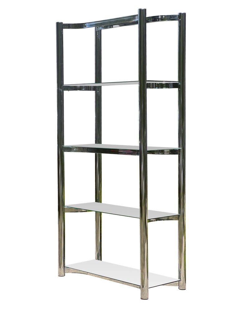 Fabulous mid-century étagère in chrome plated steel with glass shelves, 1970's.

This beautiful étagère features lustrous, curved chrome in an alternating pattern supporting the glass shelves. This is a high quality, well crafted and sturdy piece.