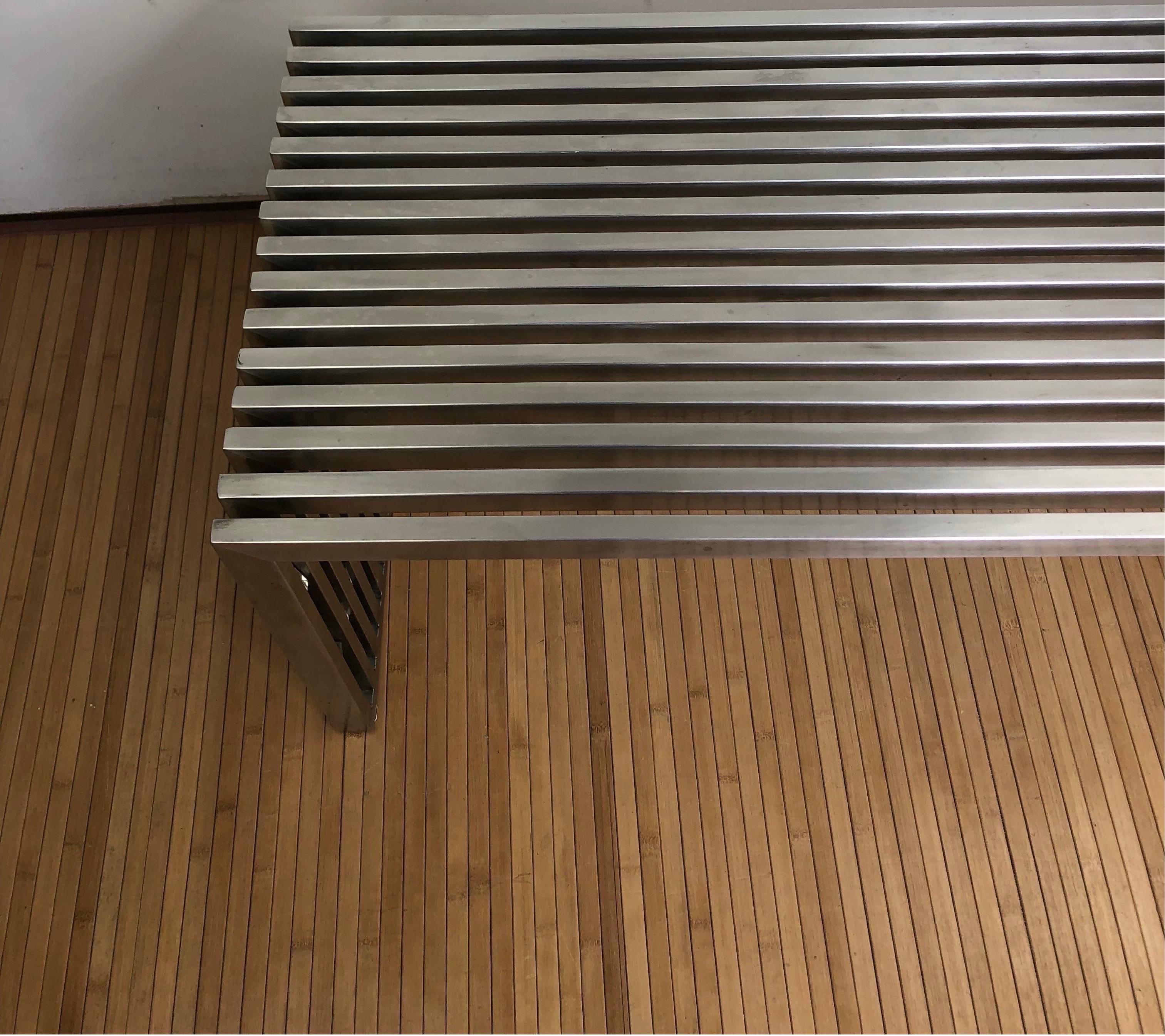 Modernist chrome slat bench in the style of Milo Baughman. Chrome plated metal square slats with unique lucite spacers.