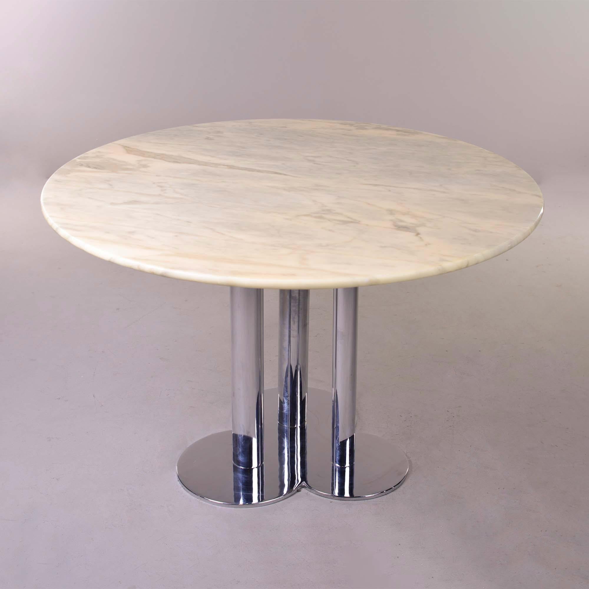 Circa 1960s table by Sergio Asti for Poltro Nova features three polished chrome legs on a trefoil form base and a creamy white and gray 45” diameter round marble top. Versatile size - works as a center table or dining table for an urban apartment,