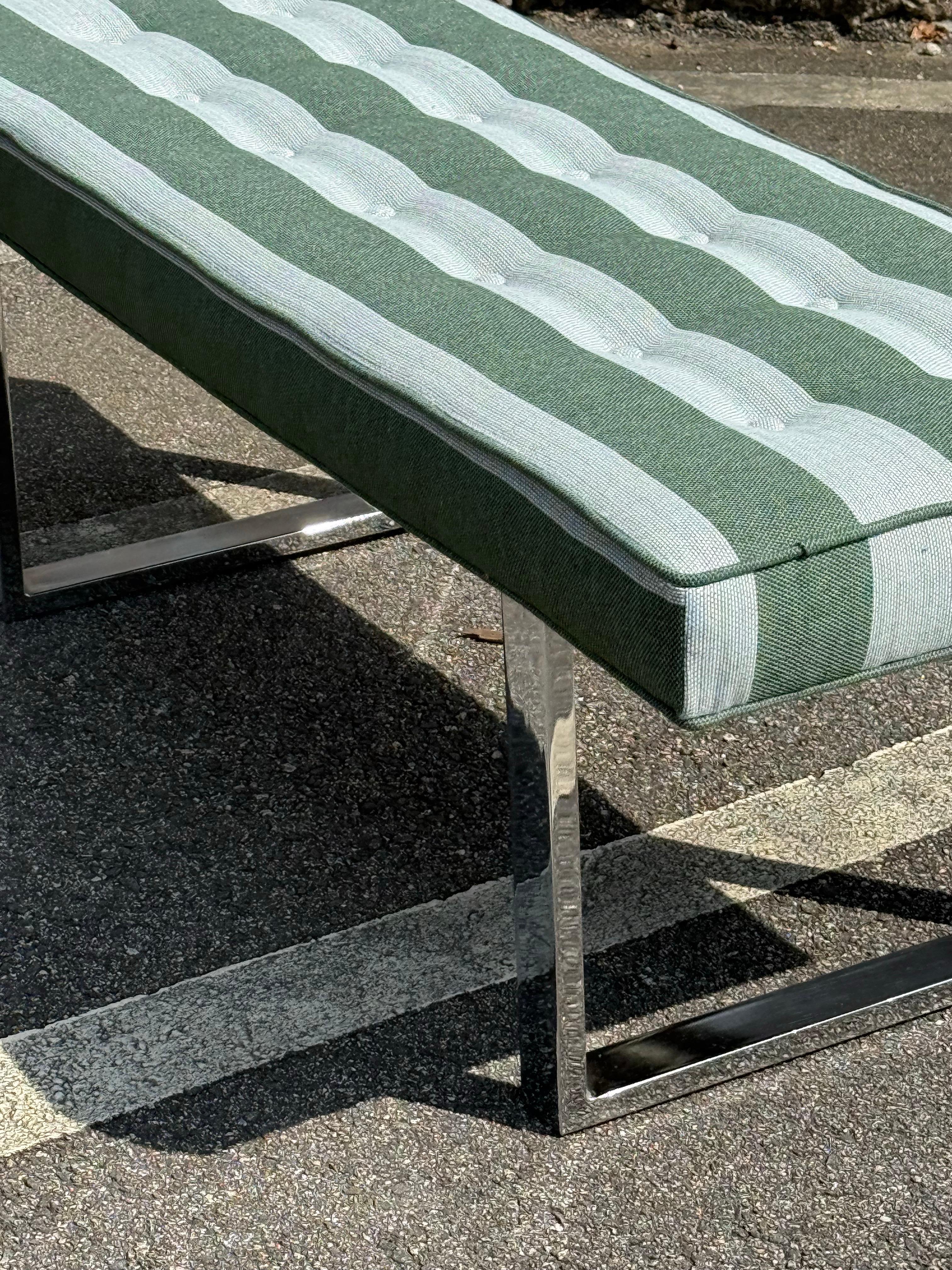 Mid-century rectangular bench sitting atop chrome squared legs. This piece has been newly reupholstered with new fabric and new foam. Fabric is alternating thick stripes of earthy green and gray. Tufted with gray buttons. The chrome and fabric