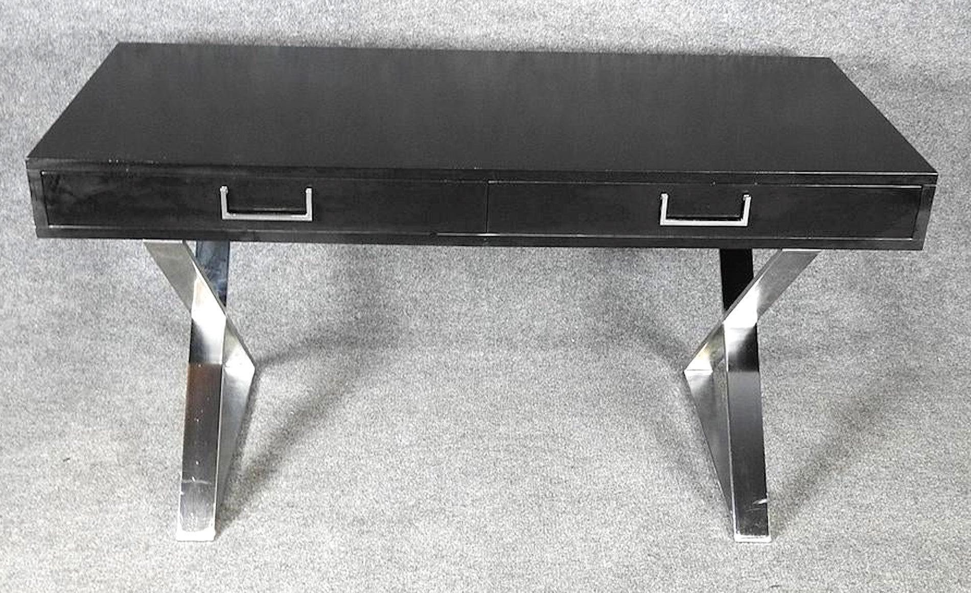 Milo Baughman style black table top with polished chrome scissor base.
(Please confirm item location - NY or NJ - with dealer).
 
