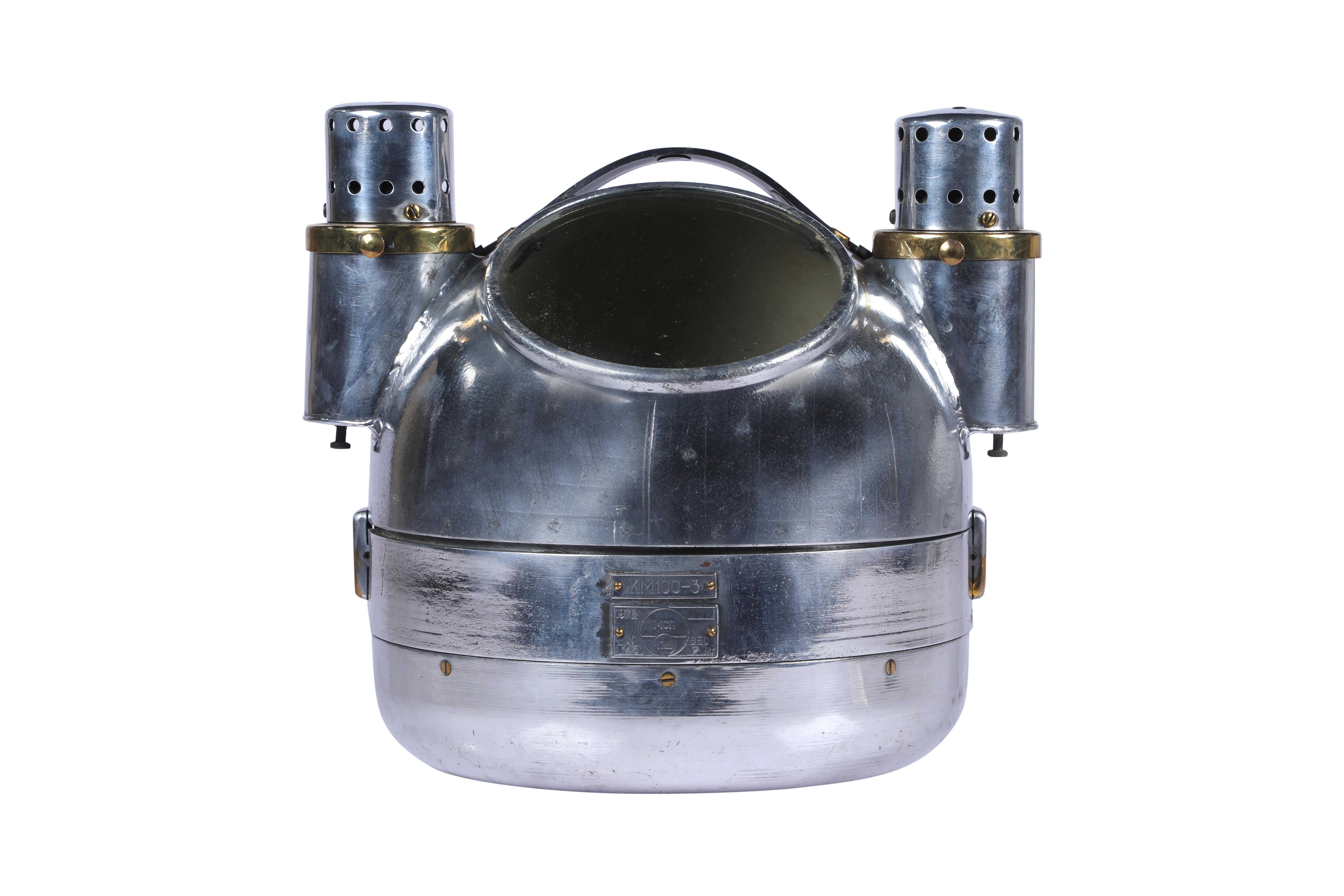 From a decommissioned lifeboat, a chrome binnacle compass in working order.  It has two oil side lights for use at night.  Top comes off.  Dated 1978.  Came off of a Russian lifeboat.  

The Lockhart Collection is a personally curated gallery of
