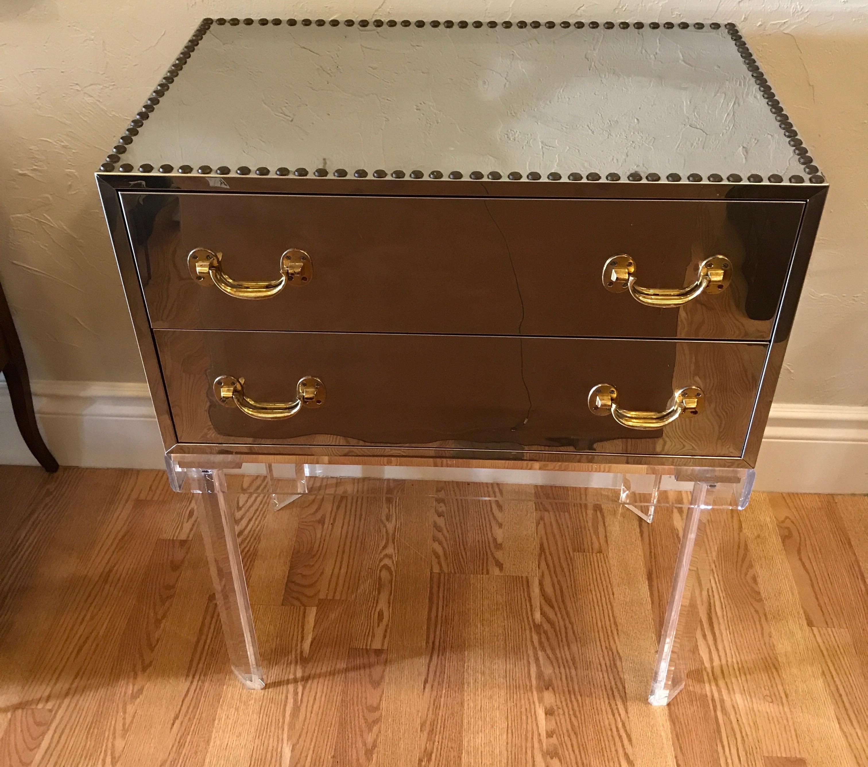 Chrome and brass two-drawer chest on lucite stand. Perfect as a dry bar.