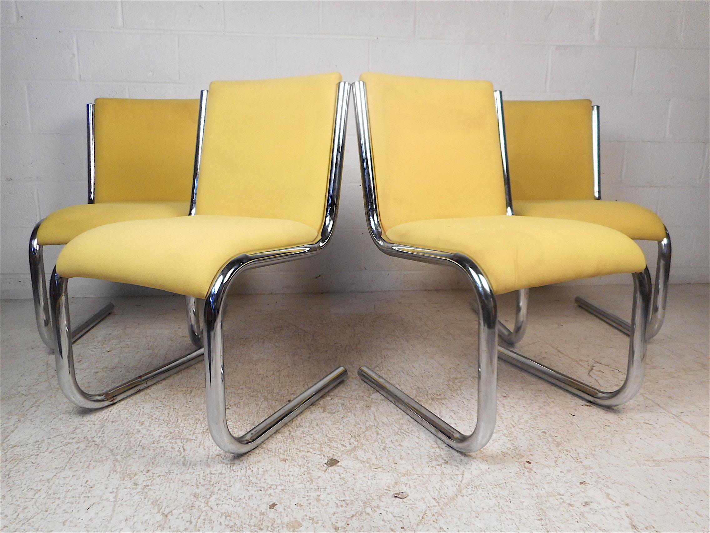 Stylish set of 4 midcentury chrome cantilevered chairs with vibrant yellow vintage upholstery. This set is sure to be a great addition to any modern interior. Please confirm item location with dealer (NJ or NY).