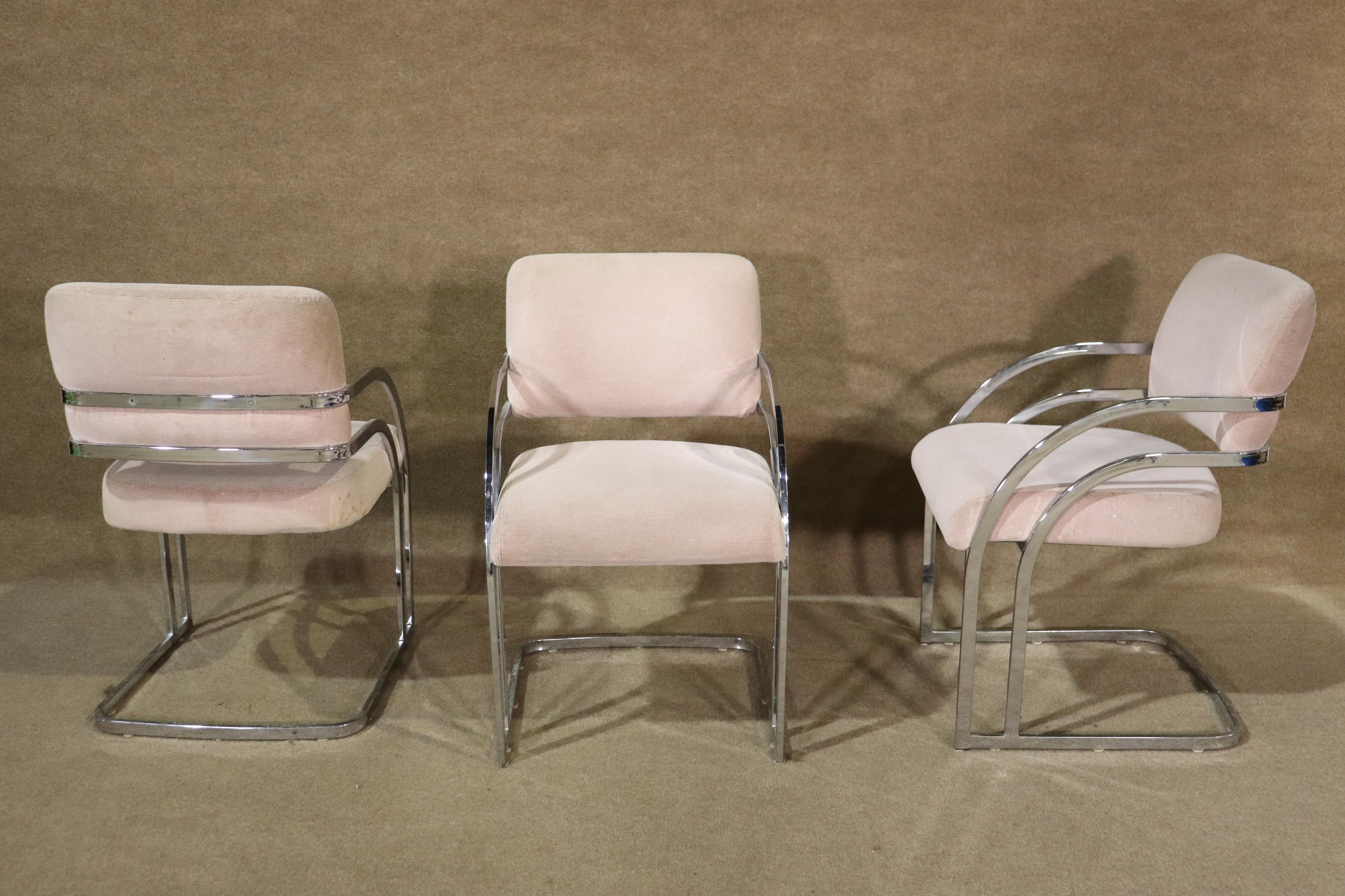 Set of four vintage modern dining chairs with flat bar polished chrome frames. Seats are suspended in a cantilever spring frame.
Please confirm location NY or NJ