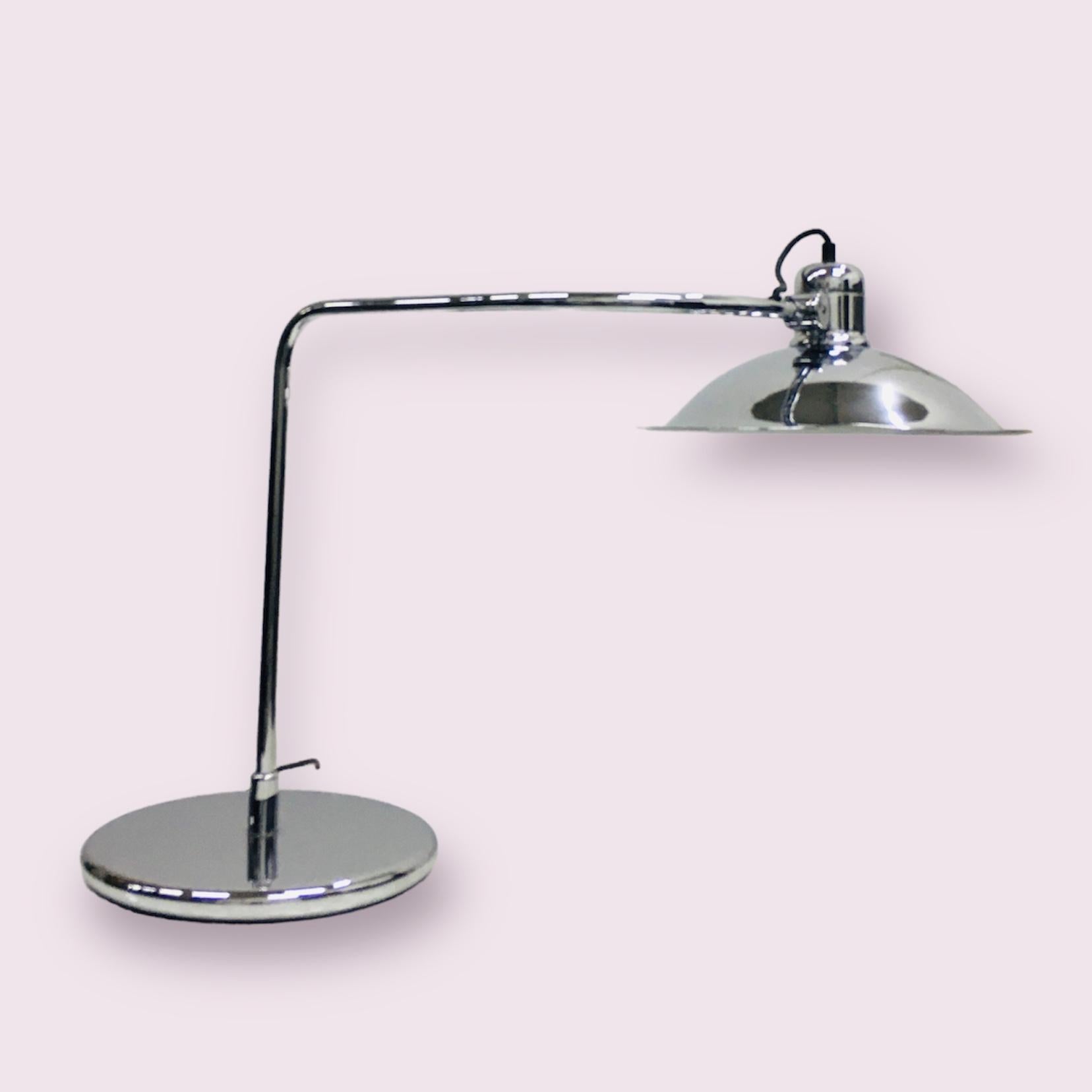 Industrial chrome table lamp with a unique bent stem. A uniquely designed piece, large table lamp. This piece entire surface is chrome-plated with adjustable head. In beautiful original vintage condition.

WORLDWIDE SHIPPING
We regularly ship items