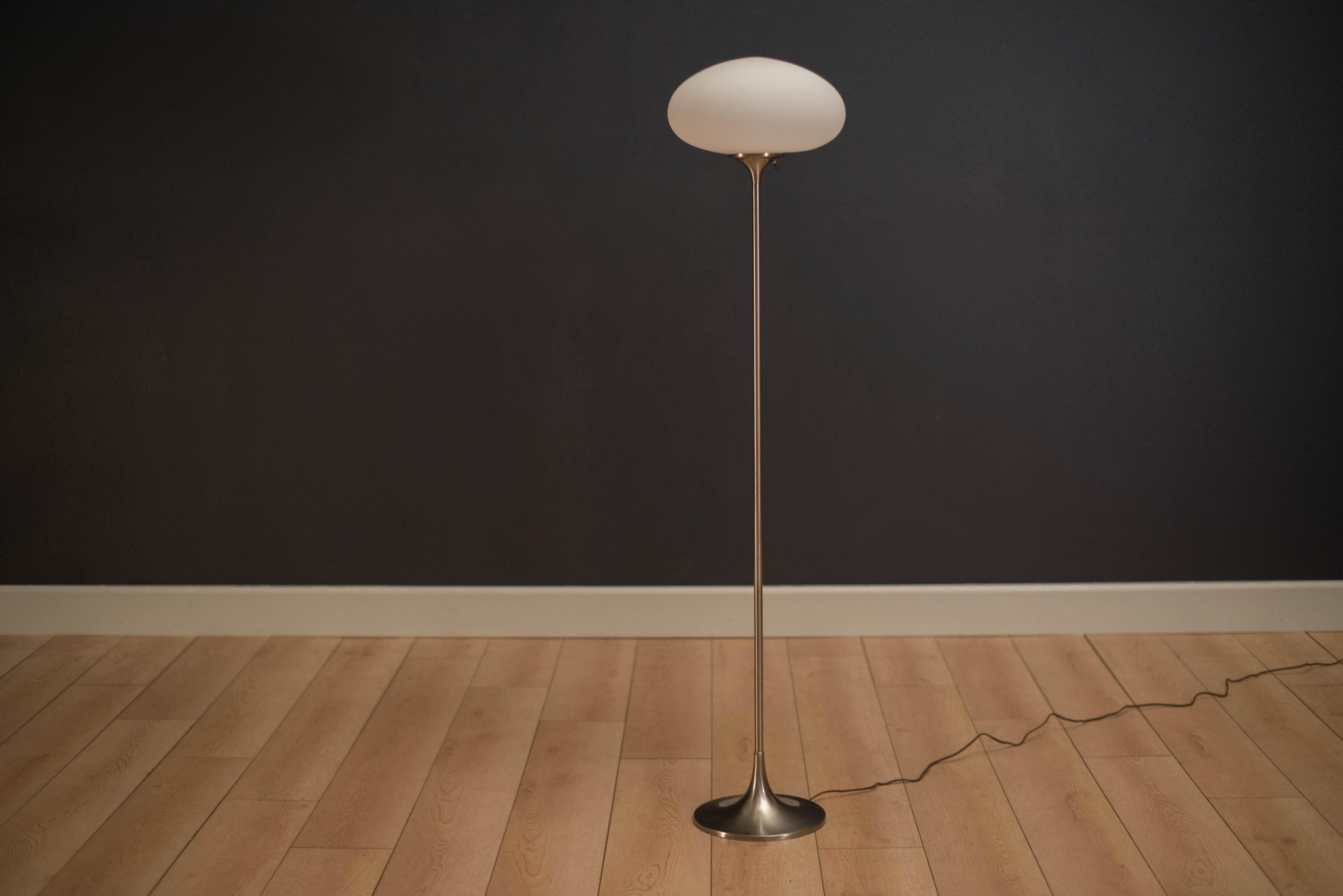 Mid-Century Modern Laurel floor lamp in chrome. This piece features a frosted glass shade and functions with a three-way switch.

   