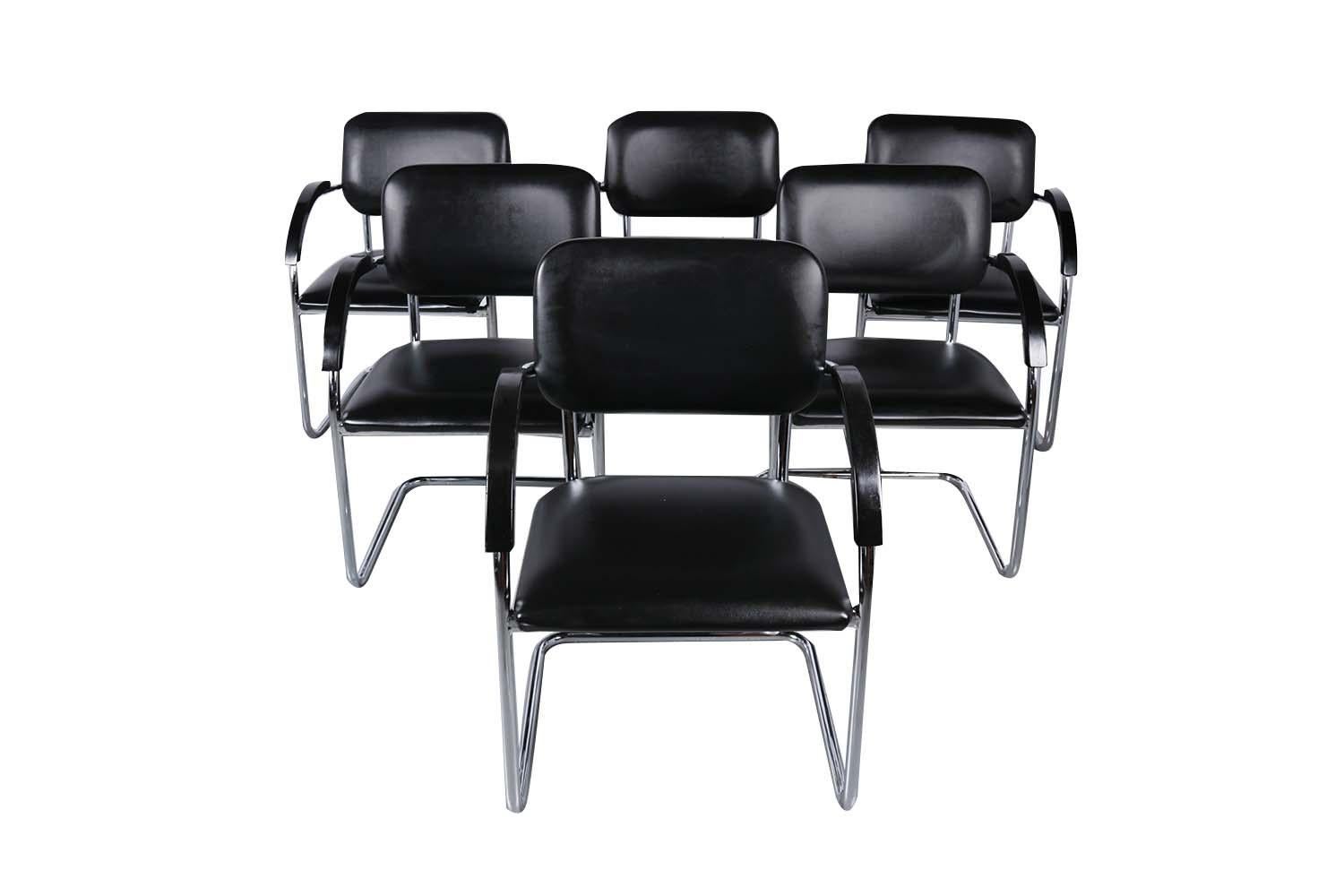 A stunning set of six vintage, Cantilevered chrome frame armchairs designed by Hank Loewenstein. In the manner of Marcel Brewer Cesca chairs. A beautiful modernist cantilever design each features chromed metal frames upholstered in original black