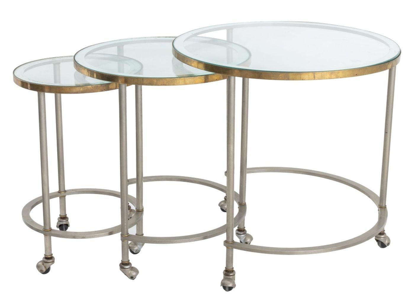 Three mid century chrome nesting tables with glass tops, all on caster wheels. 
Dimensions: 22.25