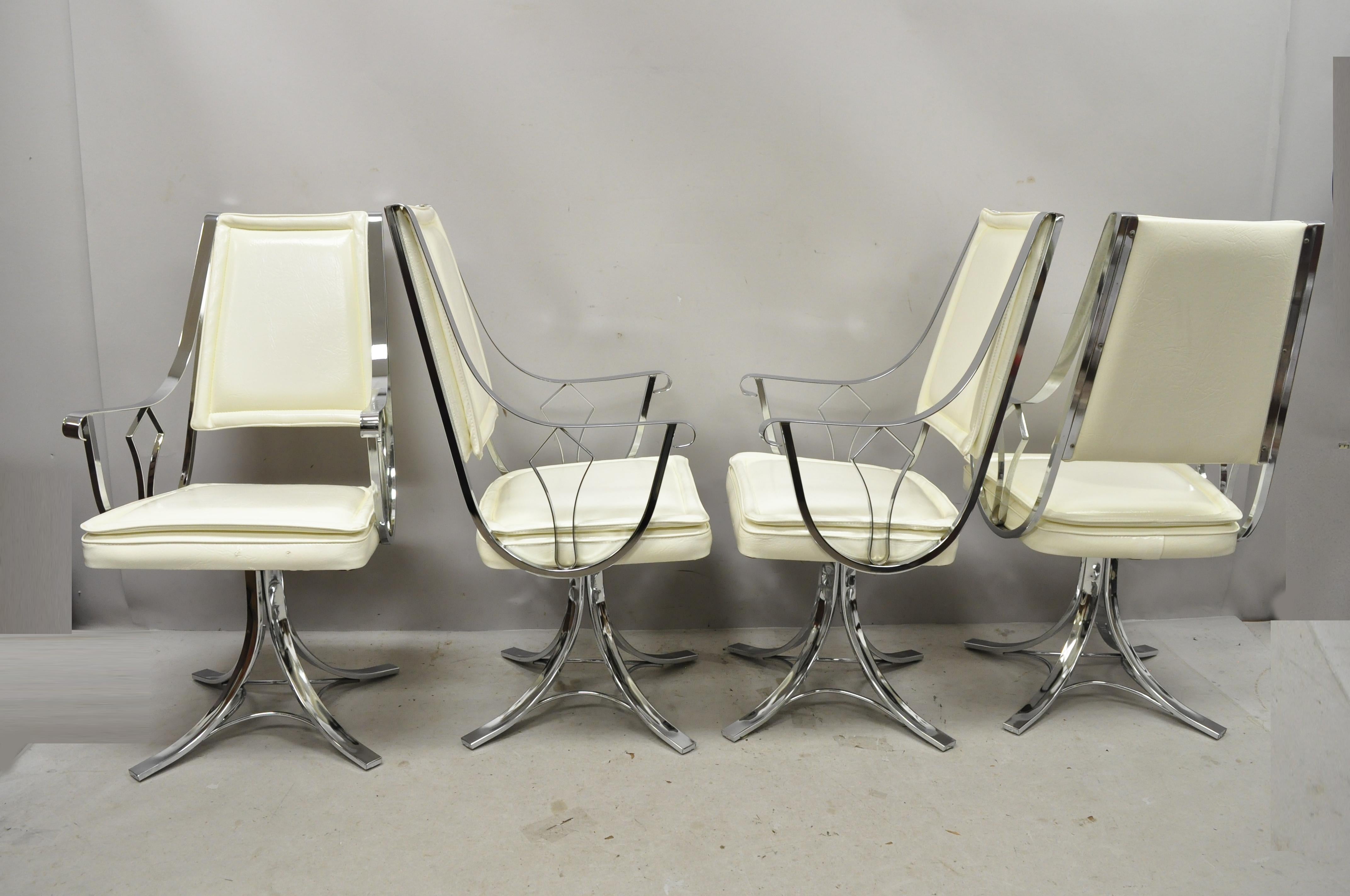 Mid-Century Modern chrome swivel white pedestal base dining armchairs by Contempo - Set of 4. Item features swivel seat, scrolling frame, pedestal base, polished chrome finish, white vinyl upholstery, original label, circa mid-late 20th century.