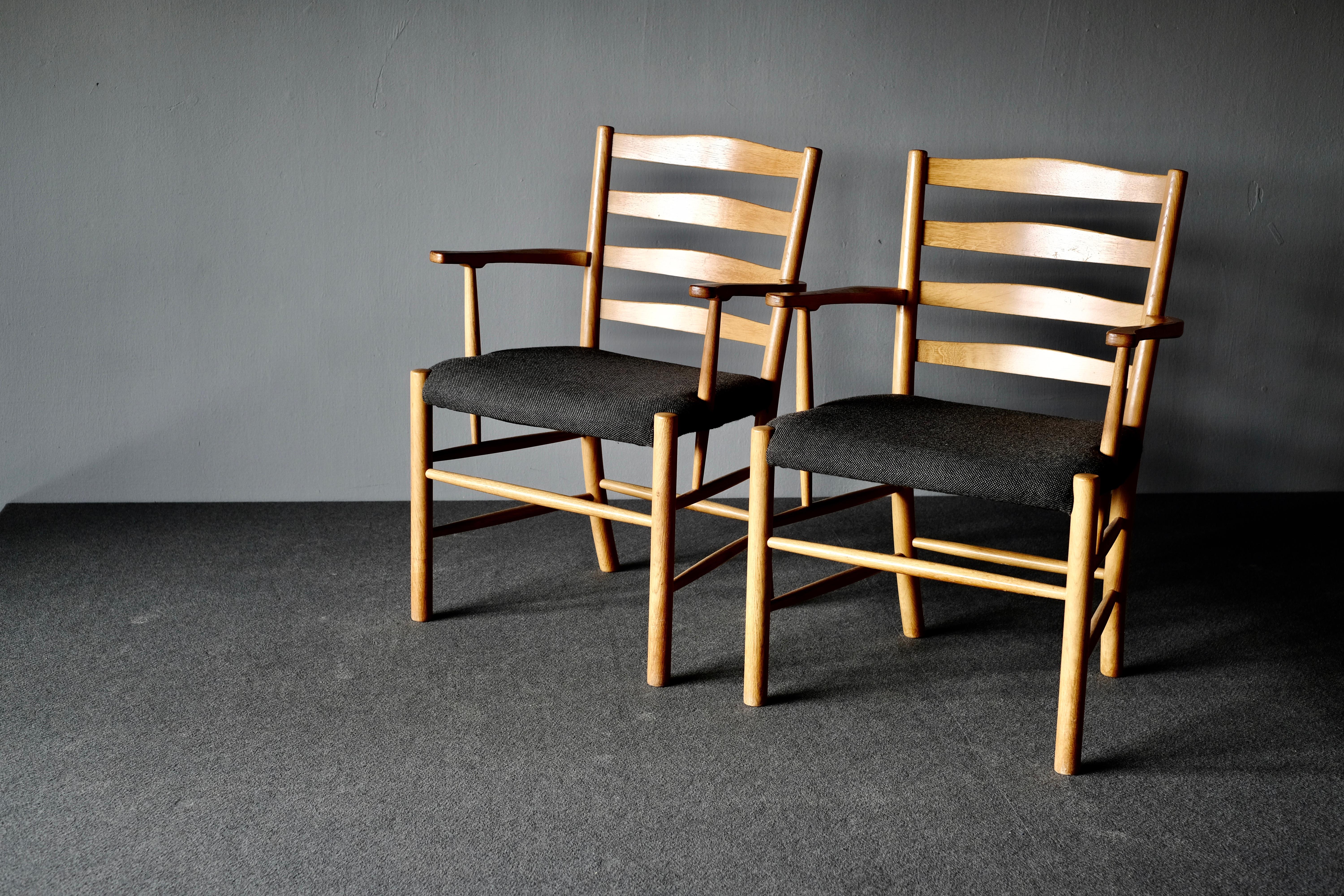 Church chairs, “Kirkestolen” by Kaare Klint and manufactured by Fritz Hansen. They are in oak, which has taken on a wonderful patina over the years. The seats are upholstered in wool.

Kaare Klint is acknowledged as one of the most influential