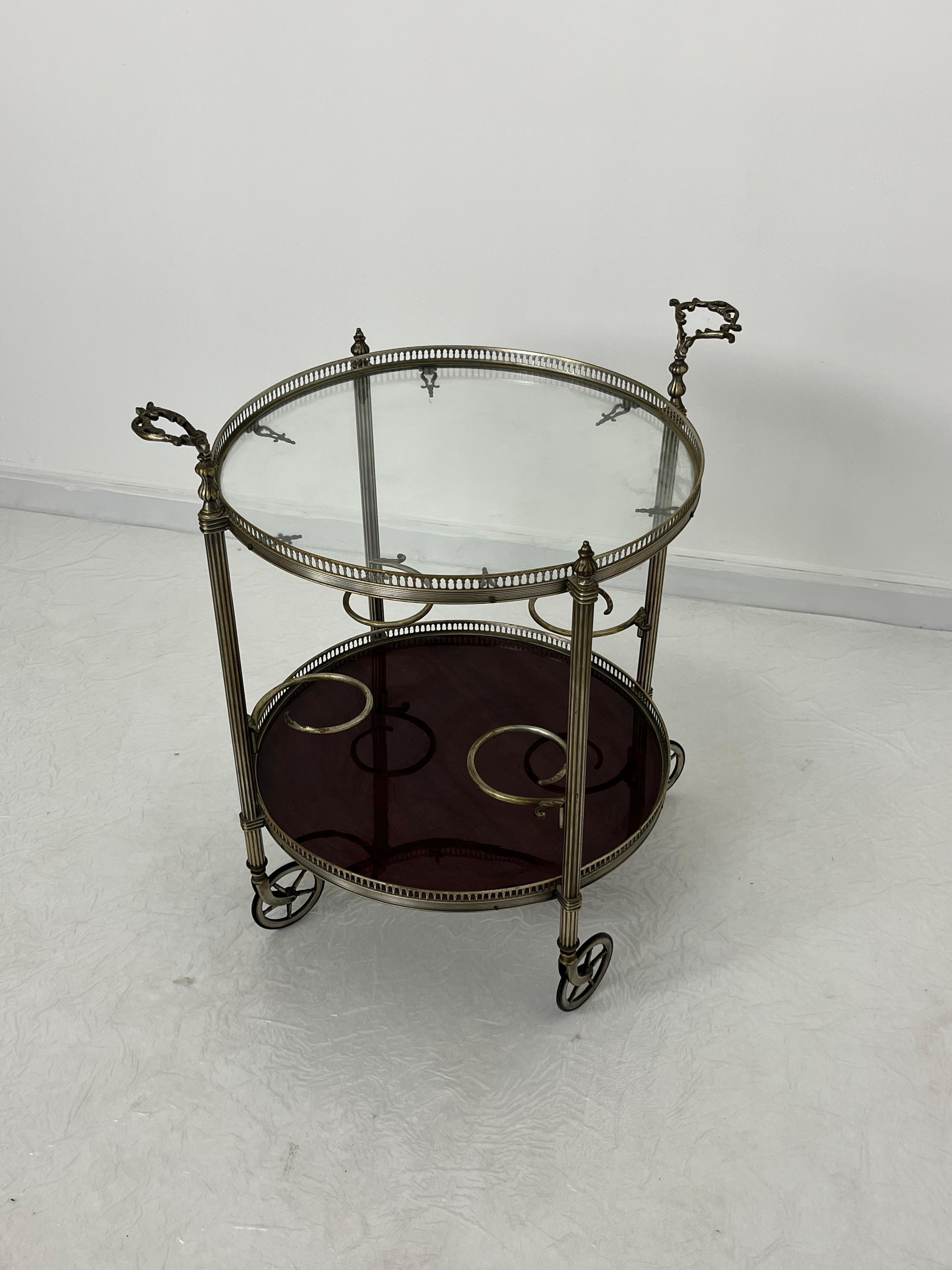 Mid-century circular brass cart with swivel wheels, 1950s
Found in a noble apartment in my hometown, Palermo.
Intact and in good condition.
Glass top.