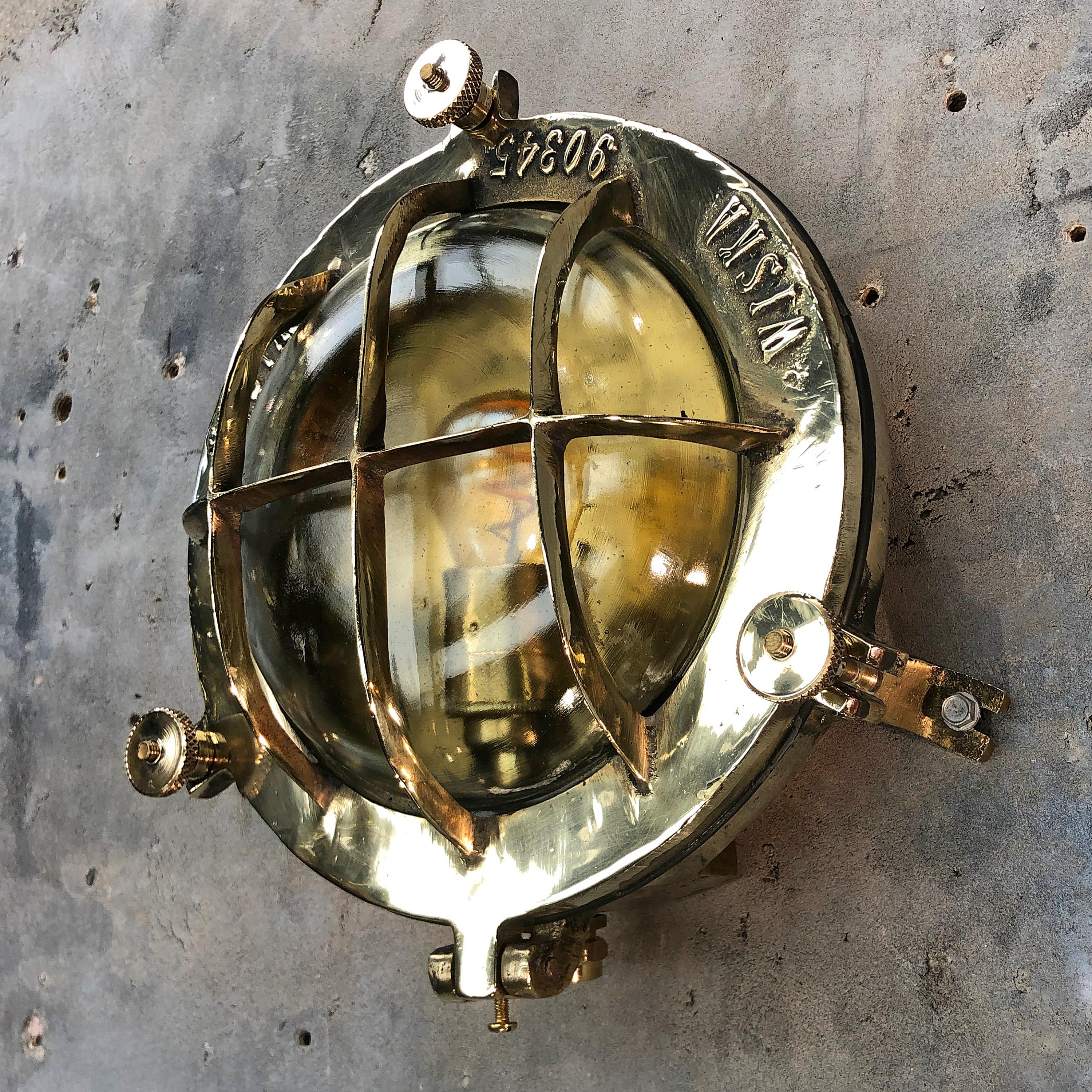 A reclaimed 1970s retro industrial circular brass bulkhead wall lighting by Wiska. 

Originally a marine lighting fixture made for super tankers and cargo ships. 

Professionally restored by Loomlight in the UK for use in modern interiors and
