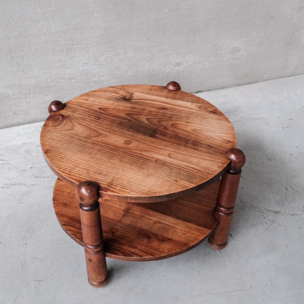 A two tier coffee table. 

France, c1950s. 

In the manner of Dudouyt. 

Good vintage condition.

Location: Belgium Gallery. 

Dimensions: 47 H x 69 Diameter in cm. 

Delivery: POA

We can ship around the world. Can be transferred to