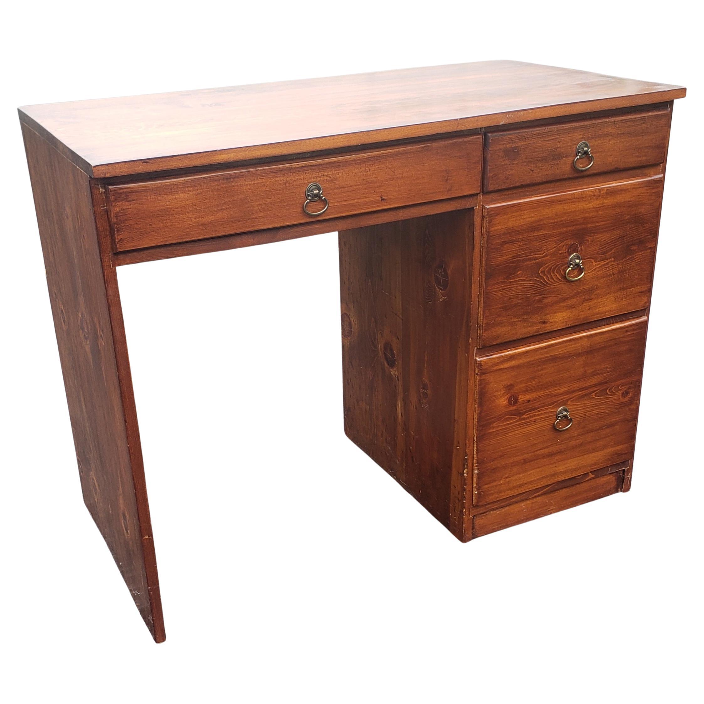 A classic 4 drawer solid study desk from the 1970s. Measures 38