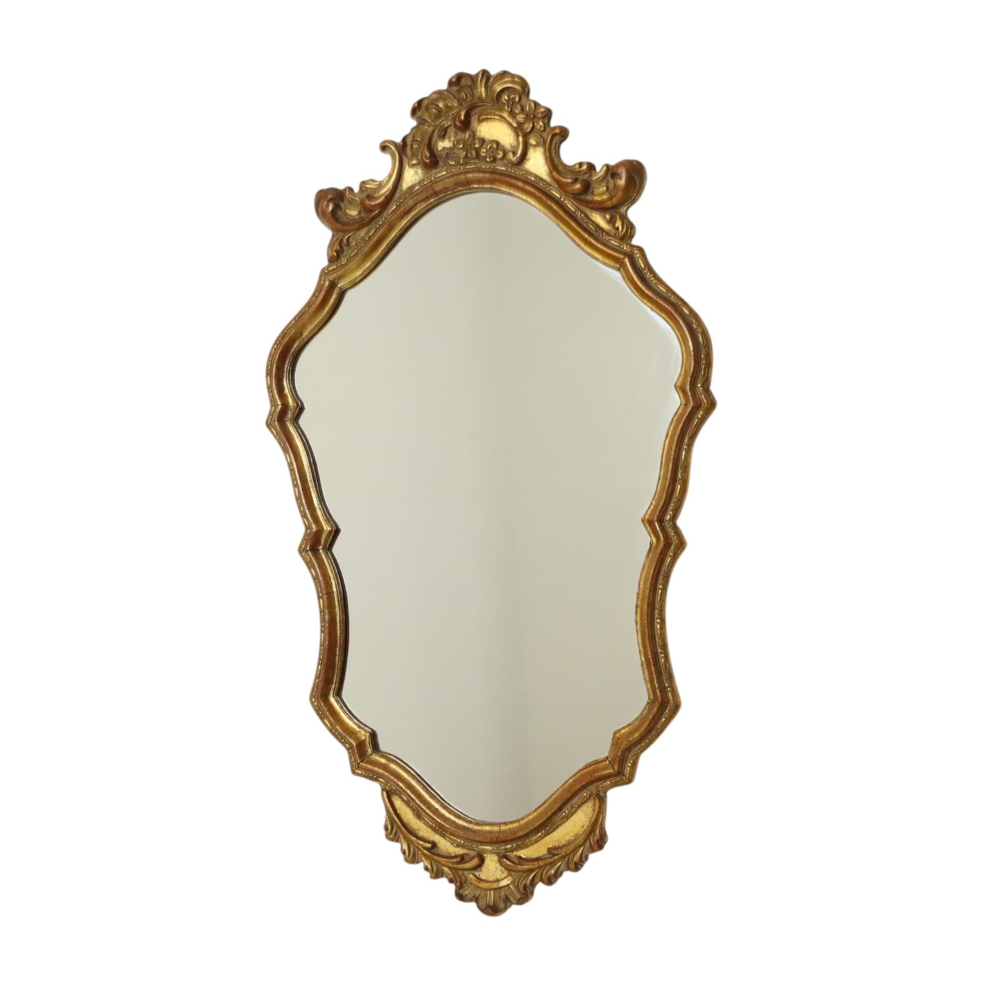 Mid-century Deknudt mirror in wooden classic frame gilded with gold leaf, completely in baroque style, the design is attributed to Deknudt, Belgium, 1950s.

Belgian house Deknudt, specialized in mirrors and founded in 1946, they are known for their