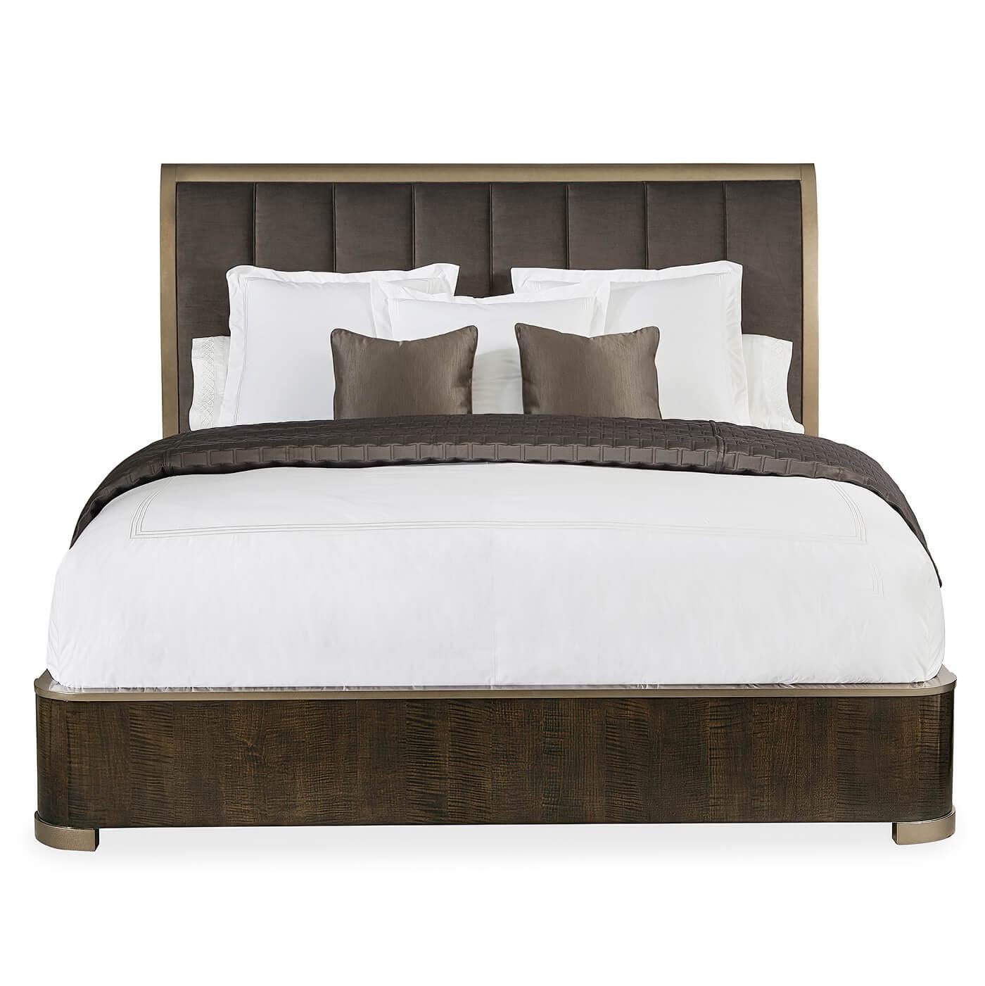 A Mid-Century Modern Classic style king size bed with a soft velvet channel upholstered headboard surrounded by our bronzed finish headboard frame. The base and footboard are of beautifully figured maple stained in a rich dark roast finish. The