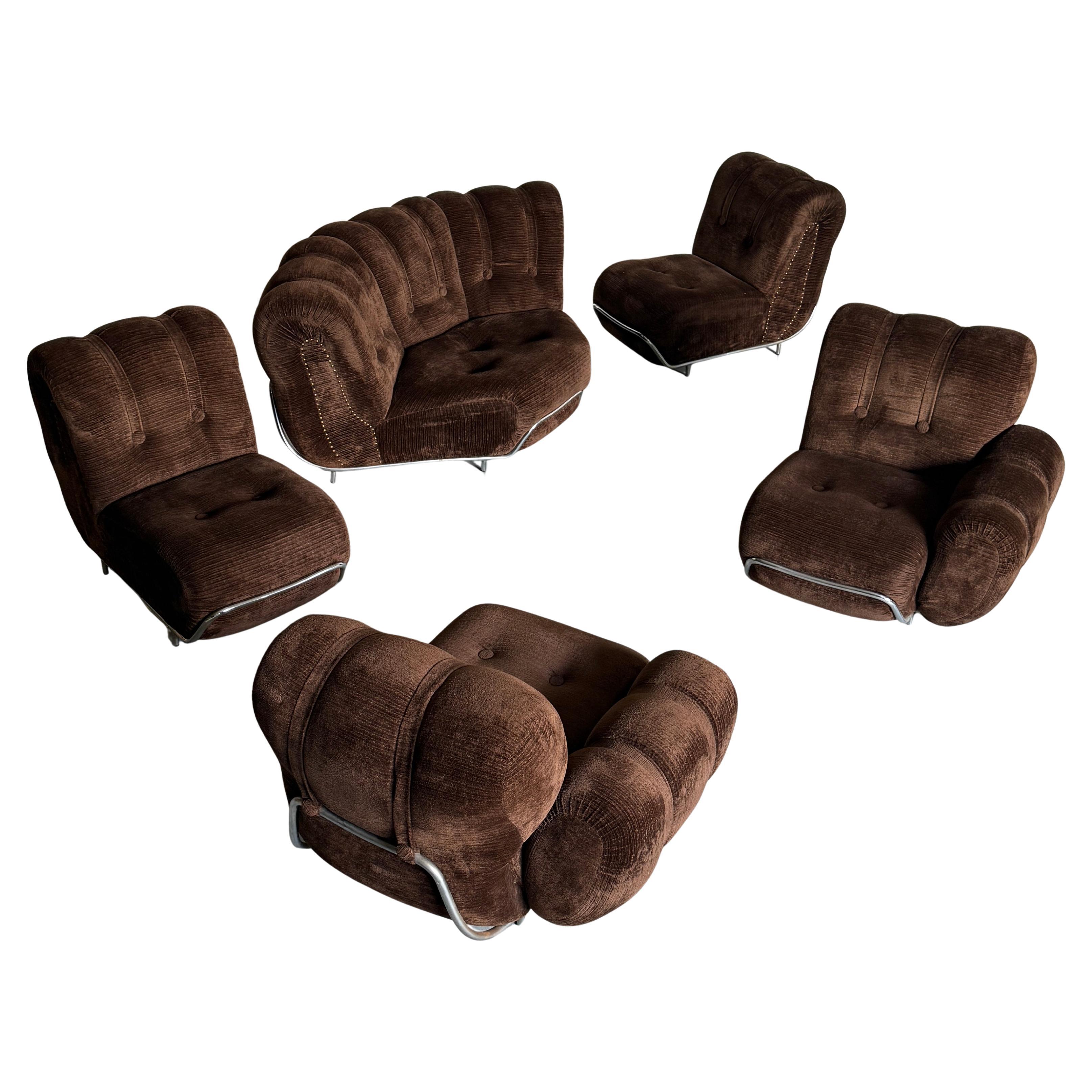 Amazing and comfortable Italian Mid-century five-piece sectional corner sofa consisting of a large corner module, two middle modules and two bookending modules. Classic Mid-century design, with a chromed steel frame which supports the upholstered