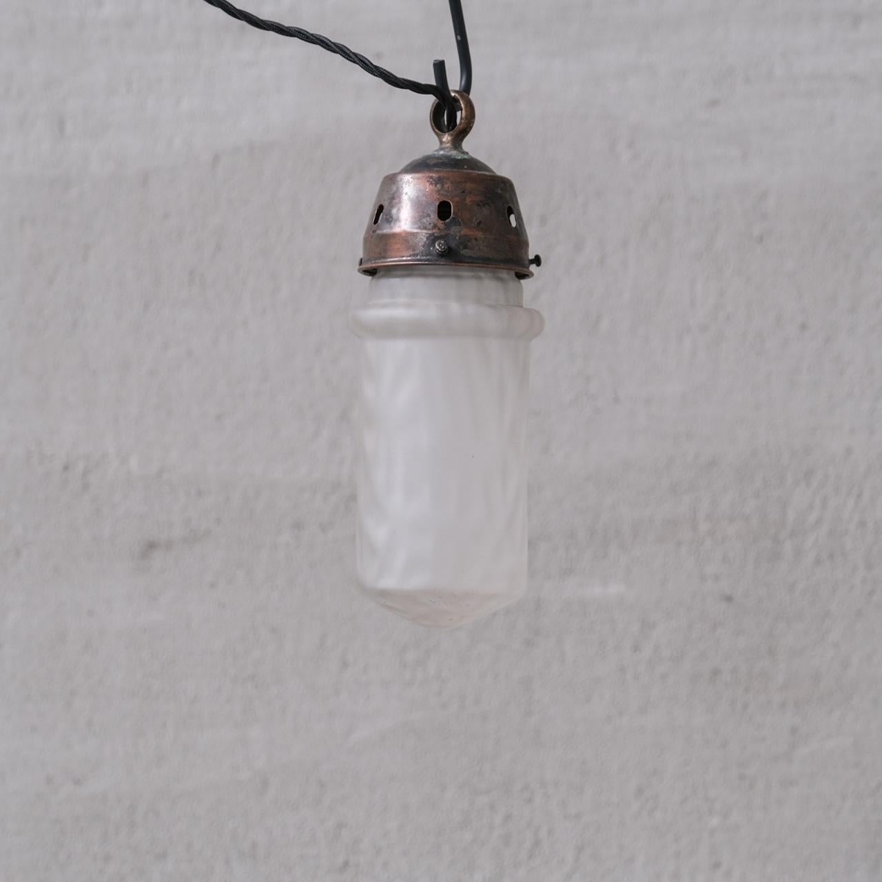 An unusual finish glass pendant light. 

France, c1960s. 

Cloudy opaque finish. 

Original gallery in naturally patinated metal. 

No rose was retained or chain, however they are easy to source online. 

Good vintage condtion, re-wired and PAT