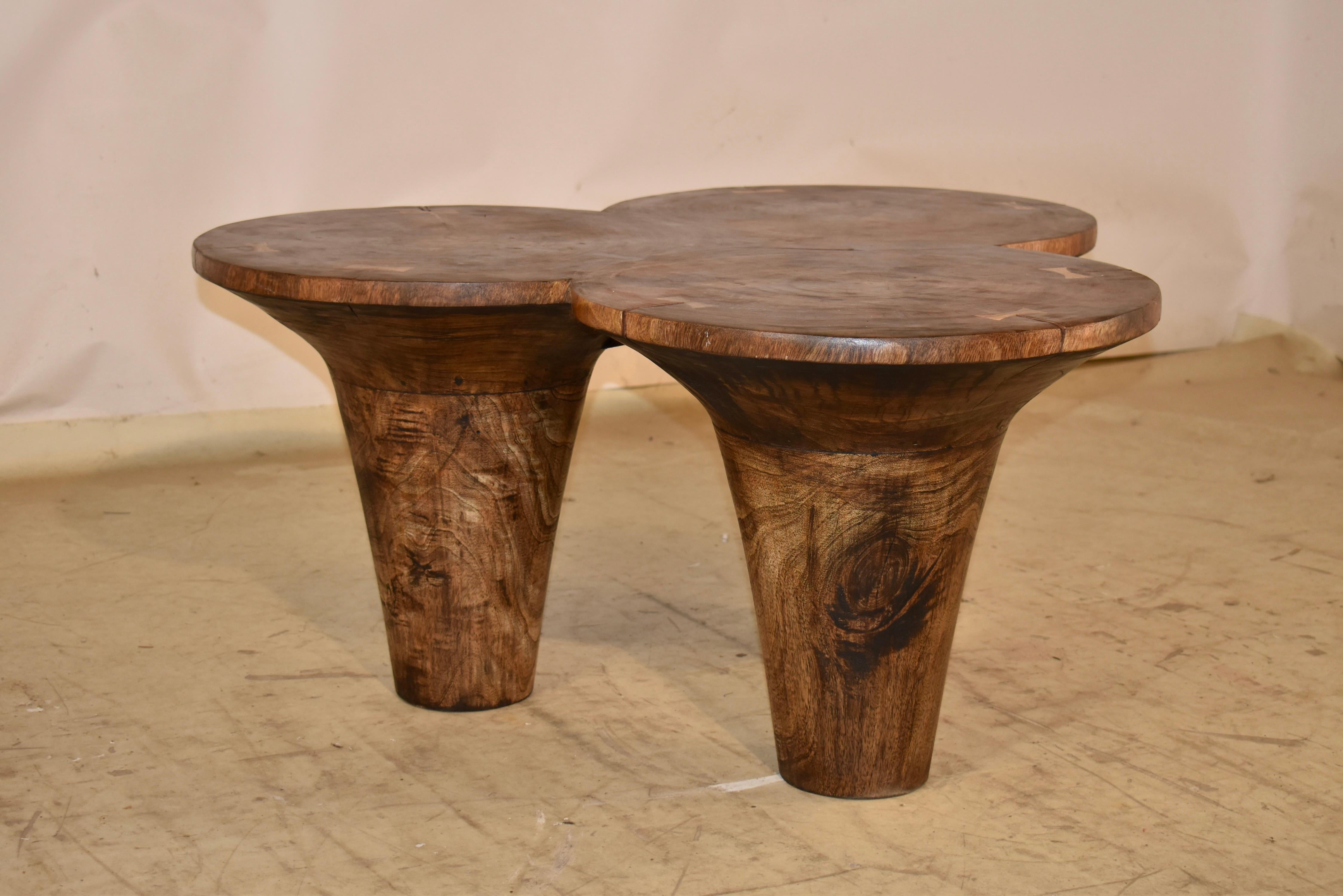 Mid-Century modern coffee table made from palm wood.  

This table is so charming!  It is made from three palms, joined together using butterfly joints.  It is such an unusual piece, and adds so much charm to any space in which it is placed.  

