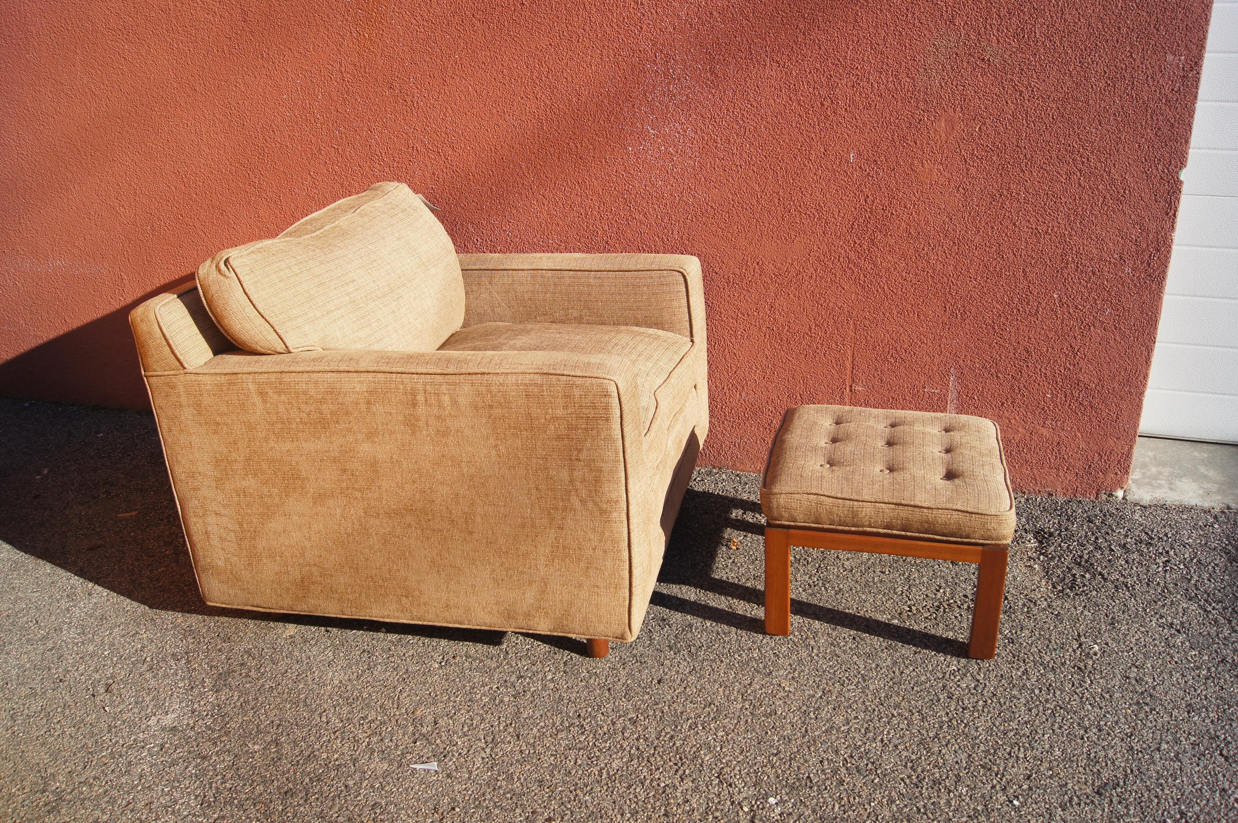 This classic mid-century club chair by Harvey Probber offers a comfortable rest with down-filled cushions on an upholstered frame set on mahogany feet. The corresponding ottoman features a tufted seat.

Dimensions below are for the club chair; the