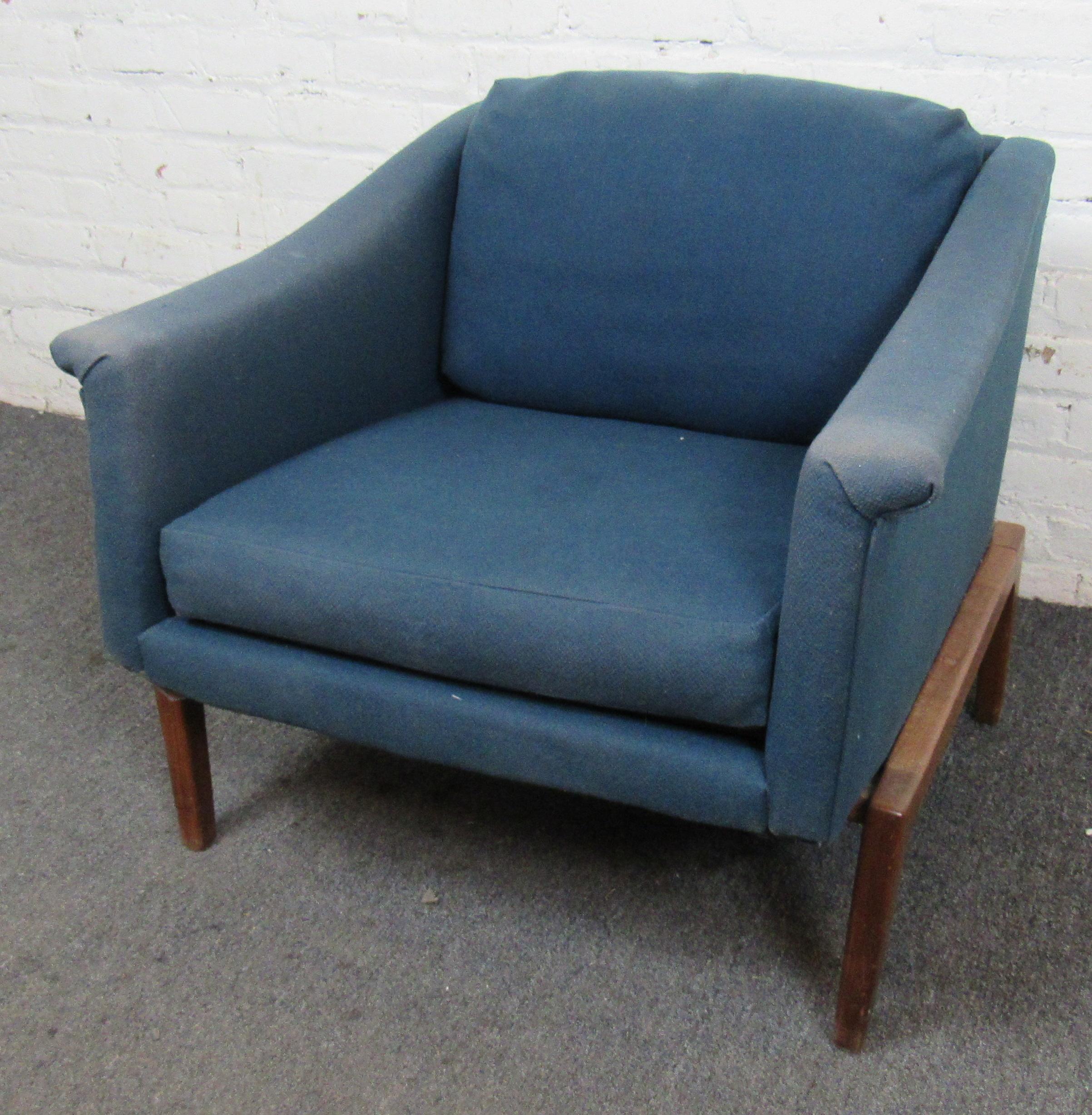 Low cube chair with blue fabric and wood frame. Well constructed Mid-Century Modern side chair for home or office.
Location: Brooklyn NY.