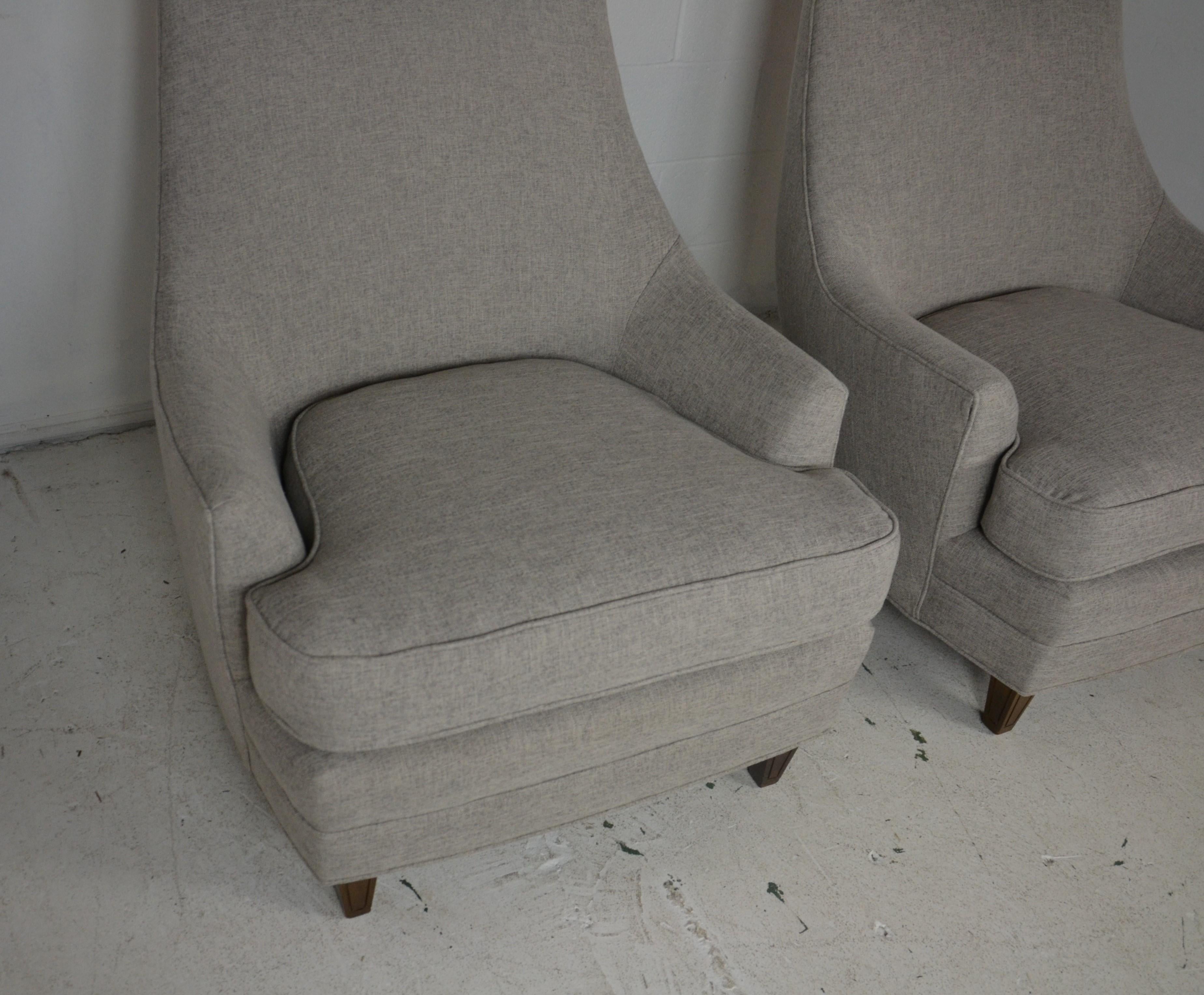 Pair of Mid-Century Club Chairs. Newly upholstered in light gray fabric.