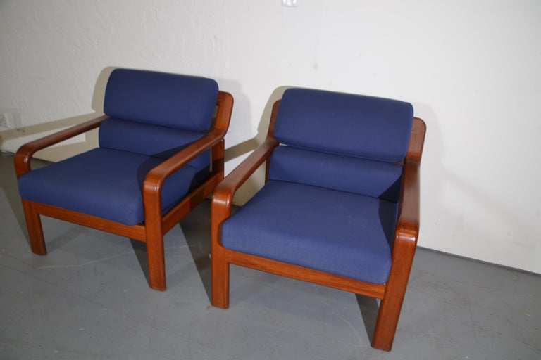 Pair of mid-century club chairs. Upholstered in blue fabric.