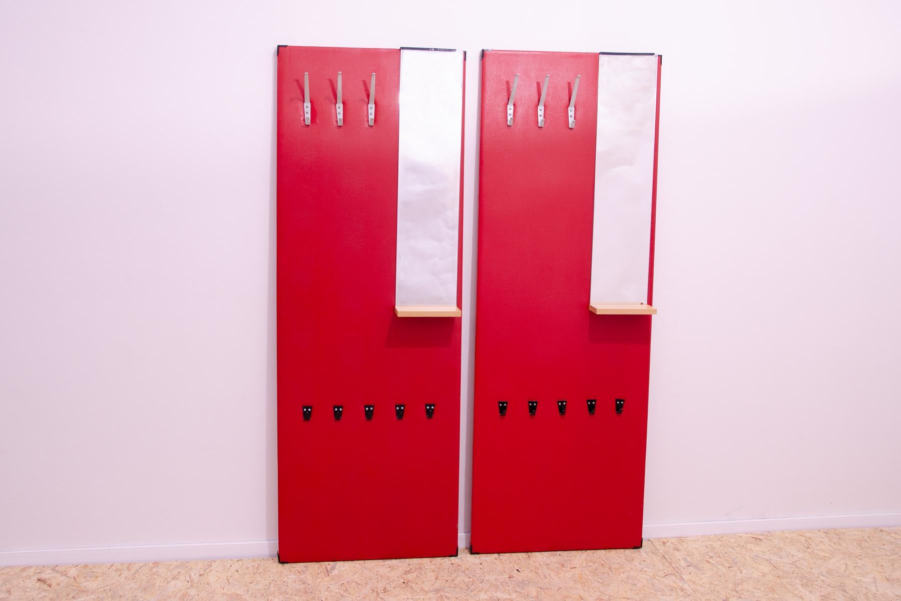 These identical hall coat racks were made in the former Czechoslovakia in the 1960s and produced by DREVOTVAR. Material: plywood, wood, leatherette, metal. It can be mounted on the wall or laid freely on the floor.

It is a characteristic example of