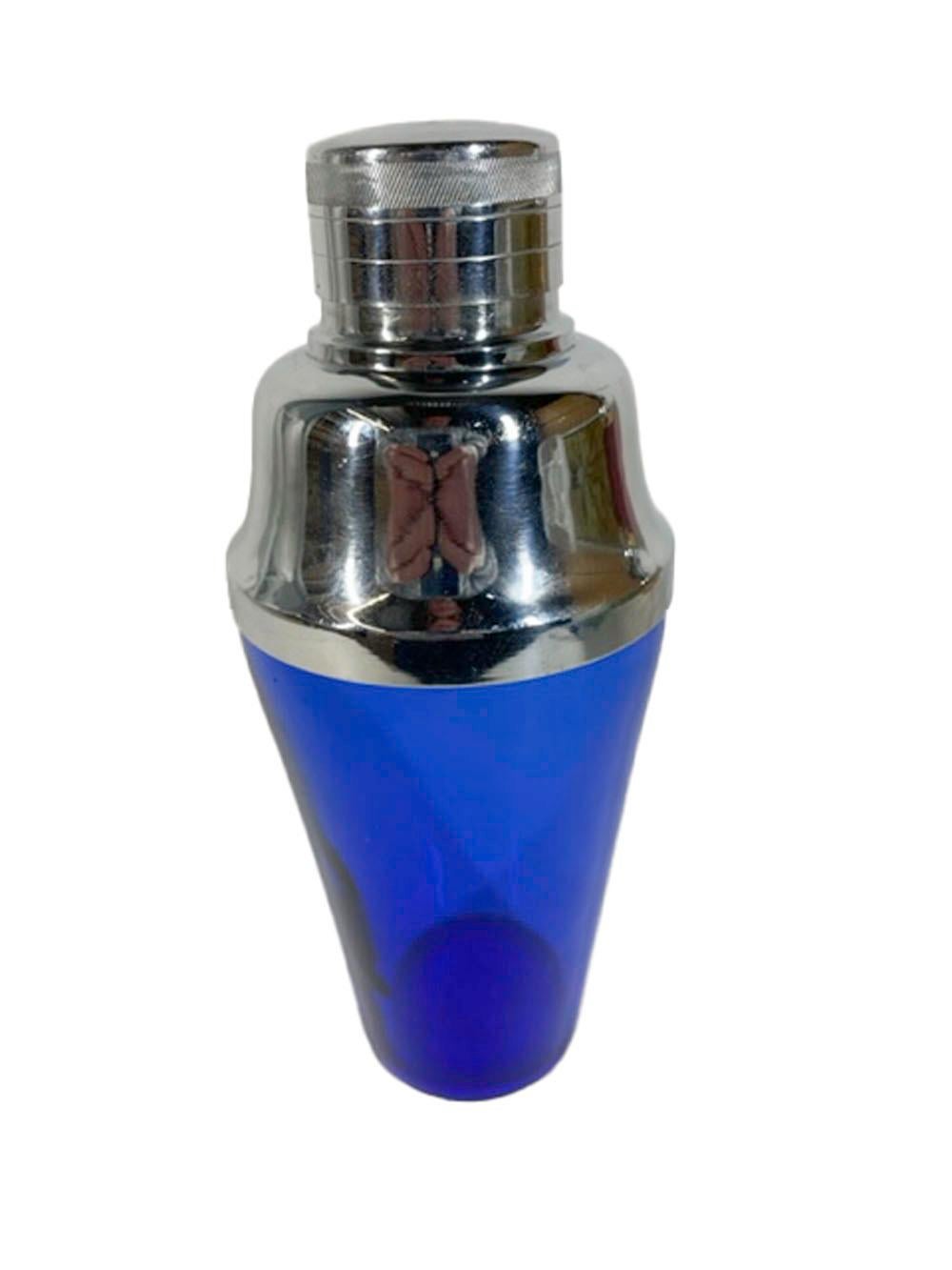 Mid-century cobalt blue glass cocktail shaker with a high domed center pour chrome lid with integral strainer and jigger cap.
