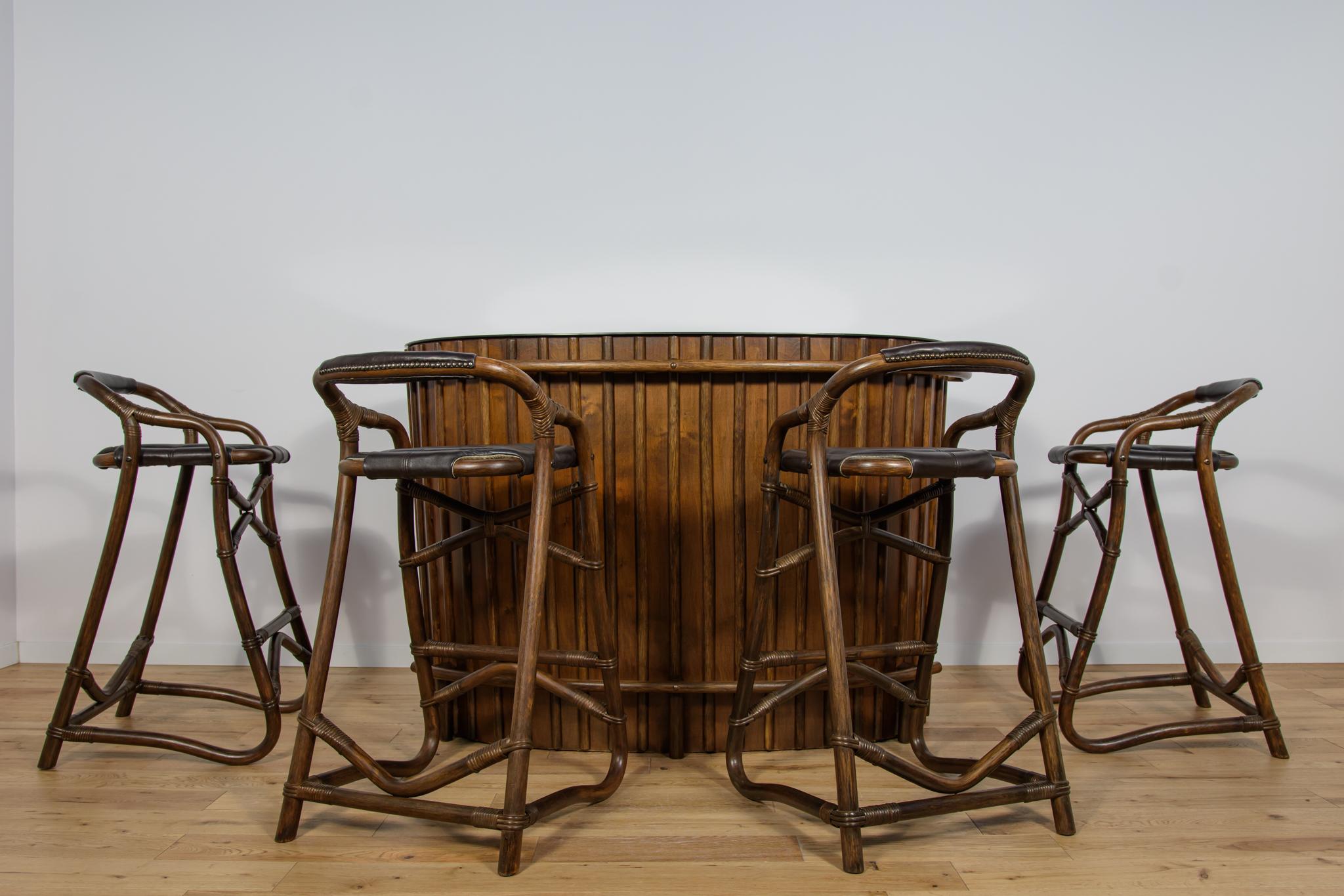 A cocktail bar made in the 1960s in France in the Boho style. The set includes a bar and 4 stools. The whole thing after professional renovation. The wood and bamboo have been renovated, cleaned and retouched. The glass on the bar has been replaced