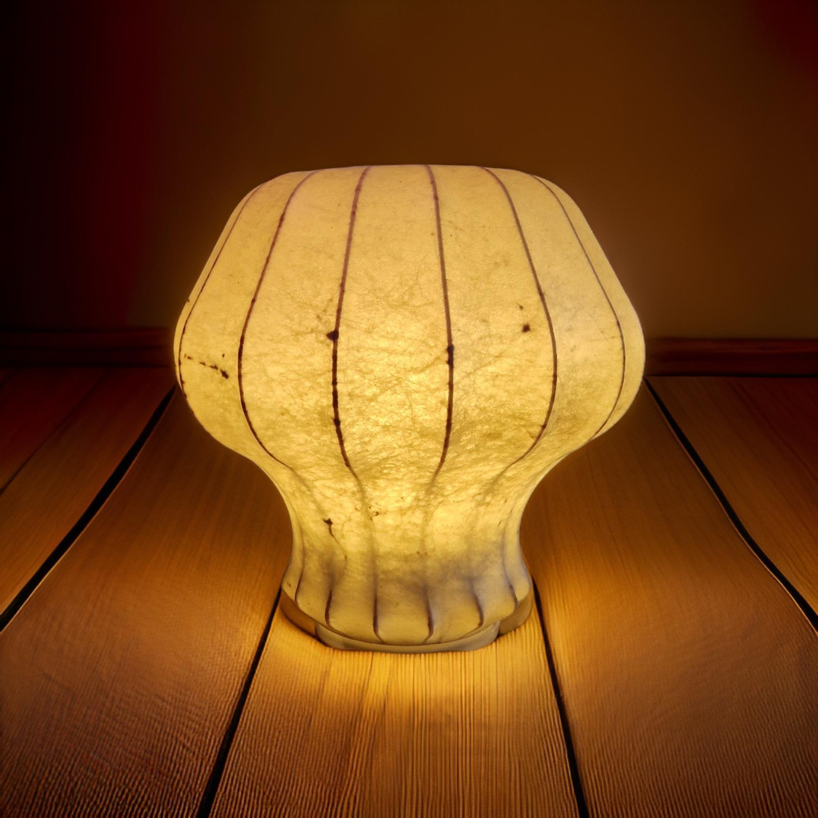 Mid century cocoon lamp. Designed by Friedel Wauer for Goldkant leuchten. The shade was made by a spray fiberglass process where an elastic fiberglass like material is sprayed on a metal frame. Due to the flexibility of the material it was possible