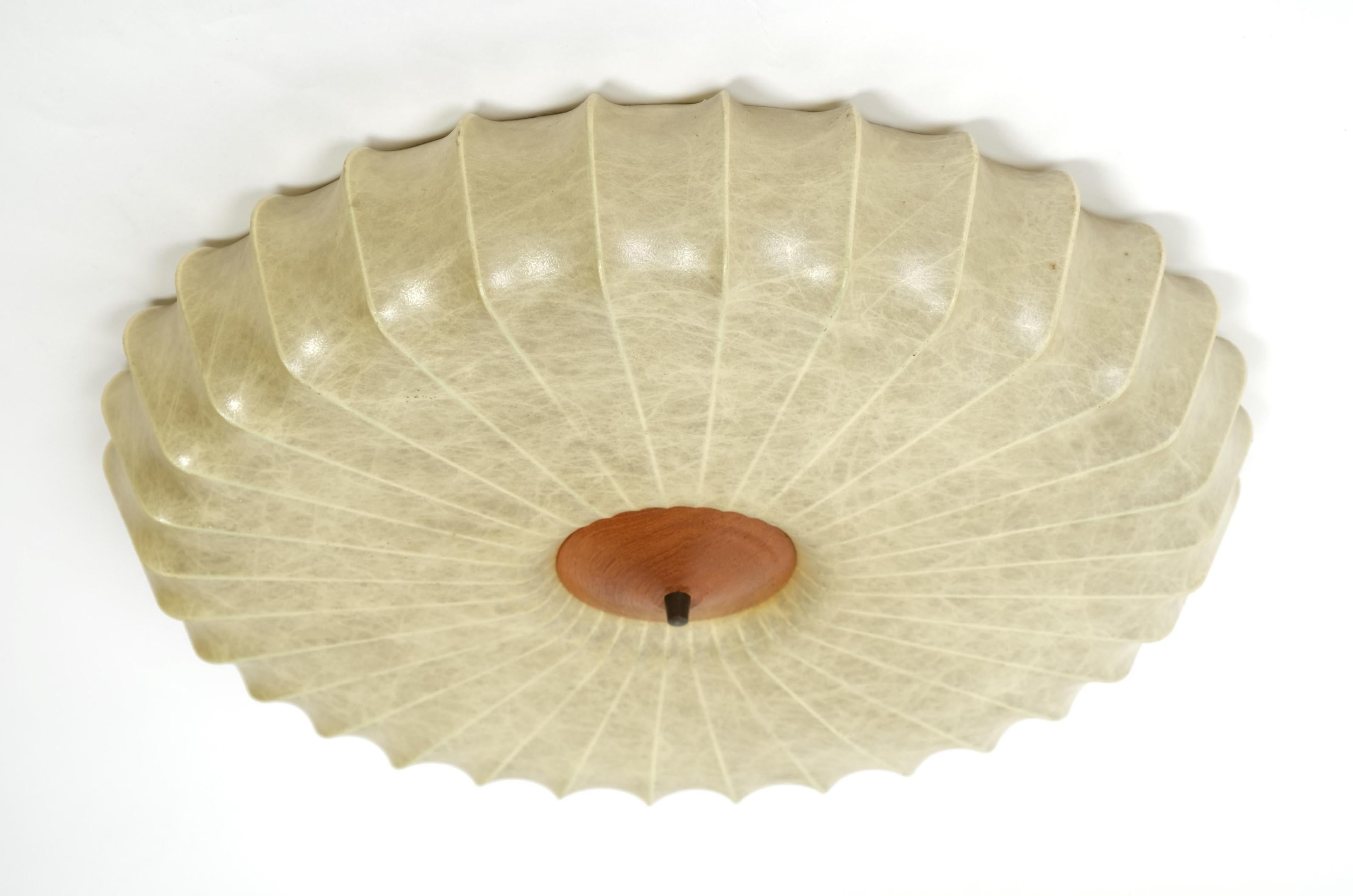 A cocoon flush mount lamp made in Italy in the 1960s. The flush mount has been manufactured in the design of the lamps made by Achille Castiglioni. The lamp shade is made of original cocoon. The screw connection is made of metal and the cover of