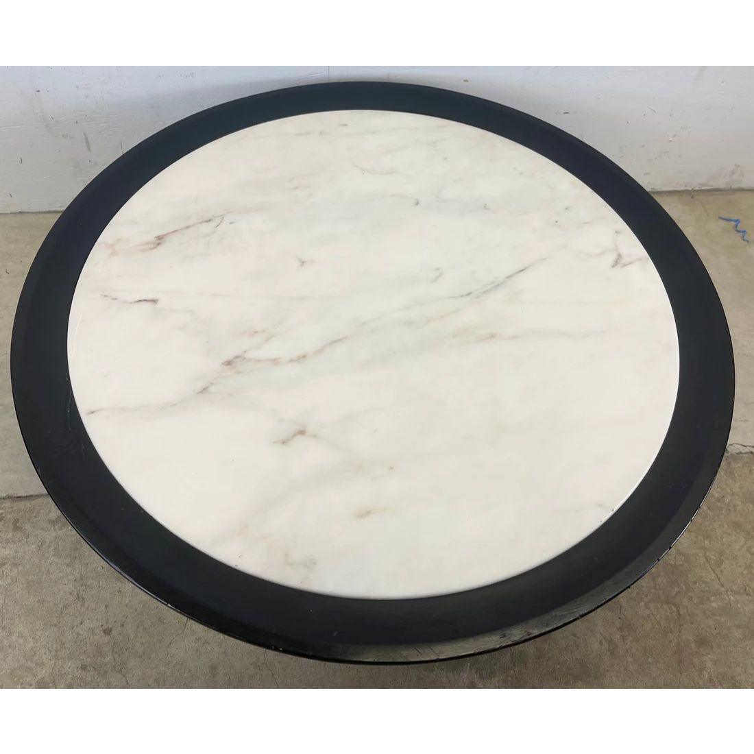 This stylish Mid-Century Modern coffee table features James Mont style. design in a circular design with black lacquer wood frame and marble finish table top. This vintage circle coffee table makes the perfect centerpiece to any seating arrangement.
