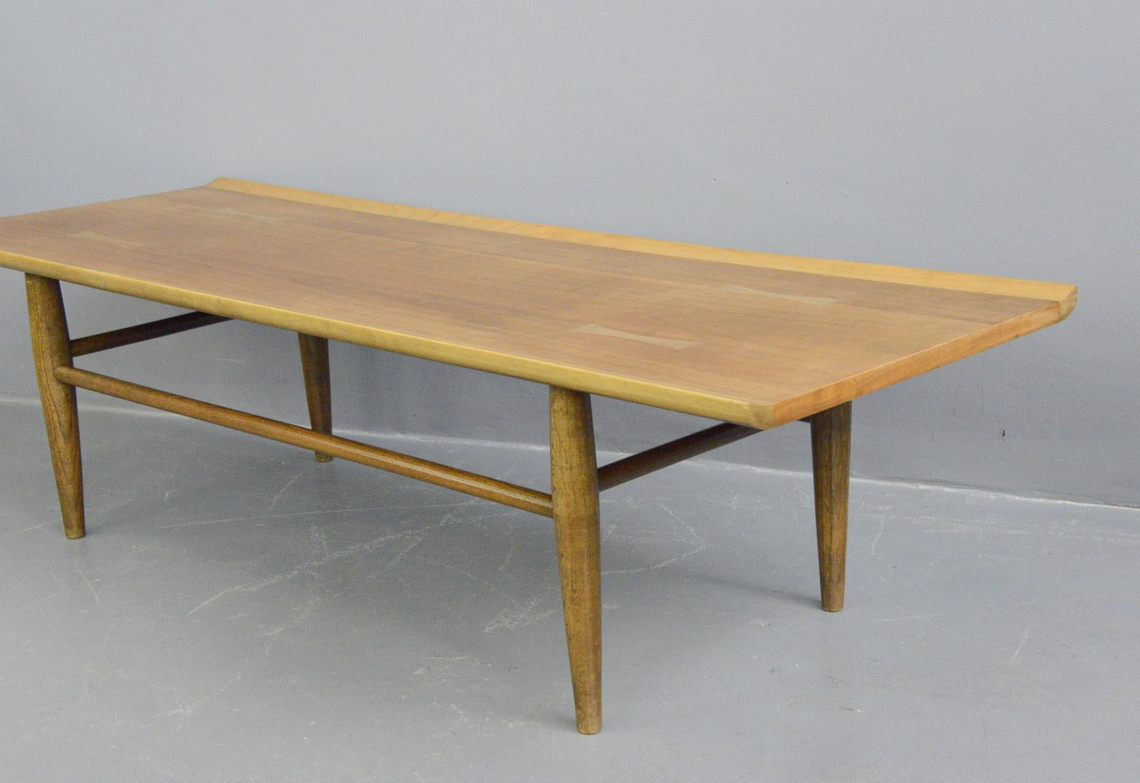Midcentury coffee table by Baumritter, circa 1950s

- Solid walnut
- Decorative bow tie joints
- Waterproof top
- Made by Baumritter
- American ~ 1950s
- 39cm deep x 39cm tall x 142cm long

Condition Report

Some very light marks in