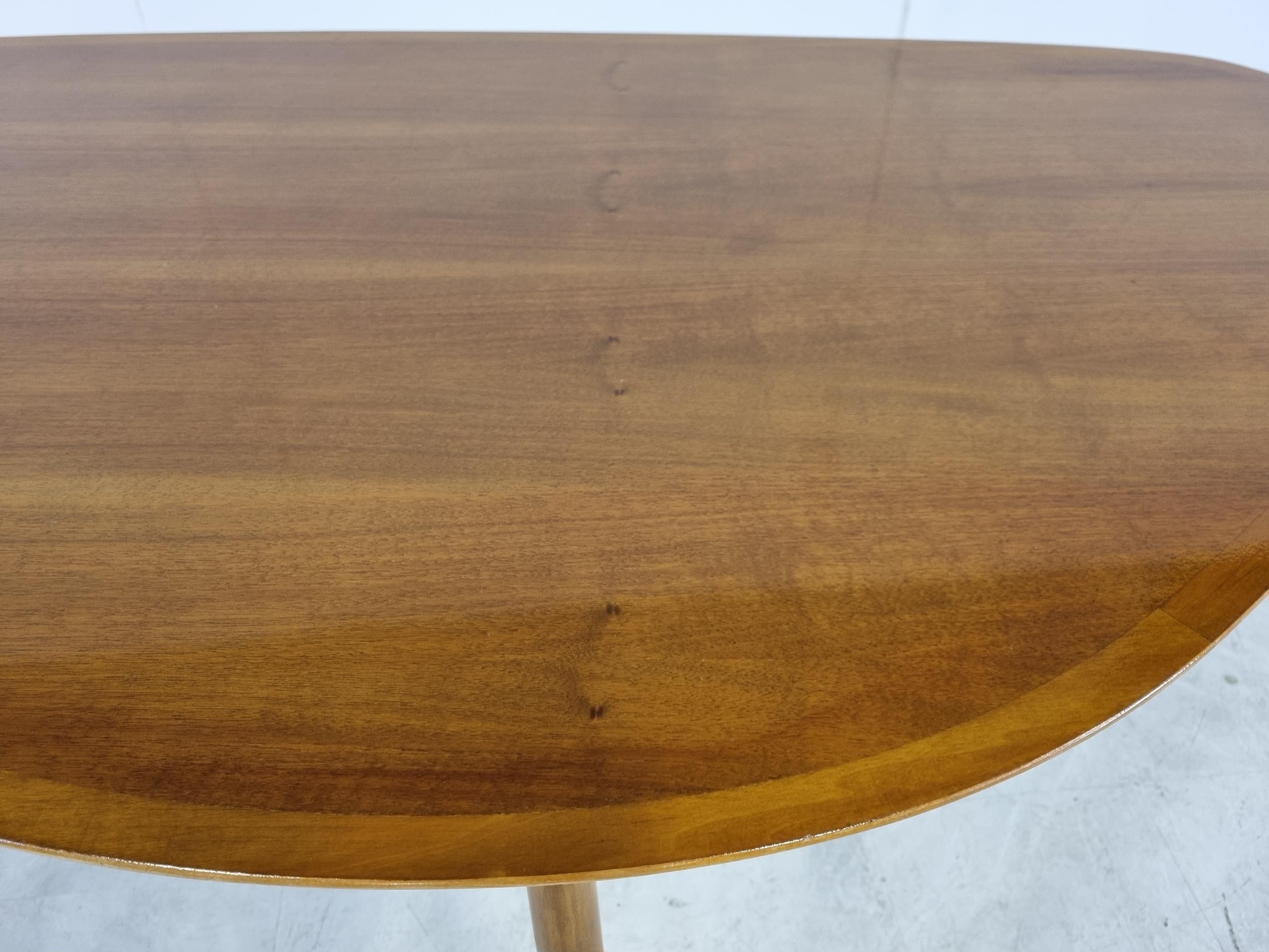 Very large mid century oraganic shaped coffee table made from teak.

Pure craftsmanship was needed to be able to create these beautifully curved wooden shapes.

Near mint condition

It can also be seated on, although it's a but lower then your