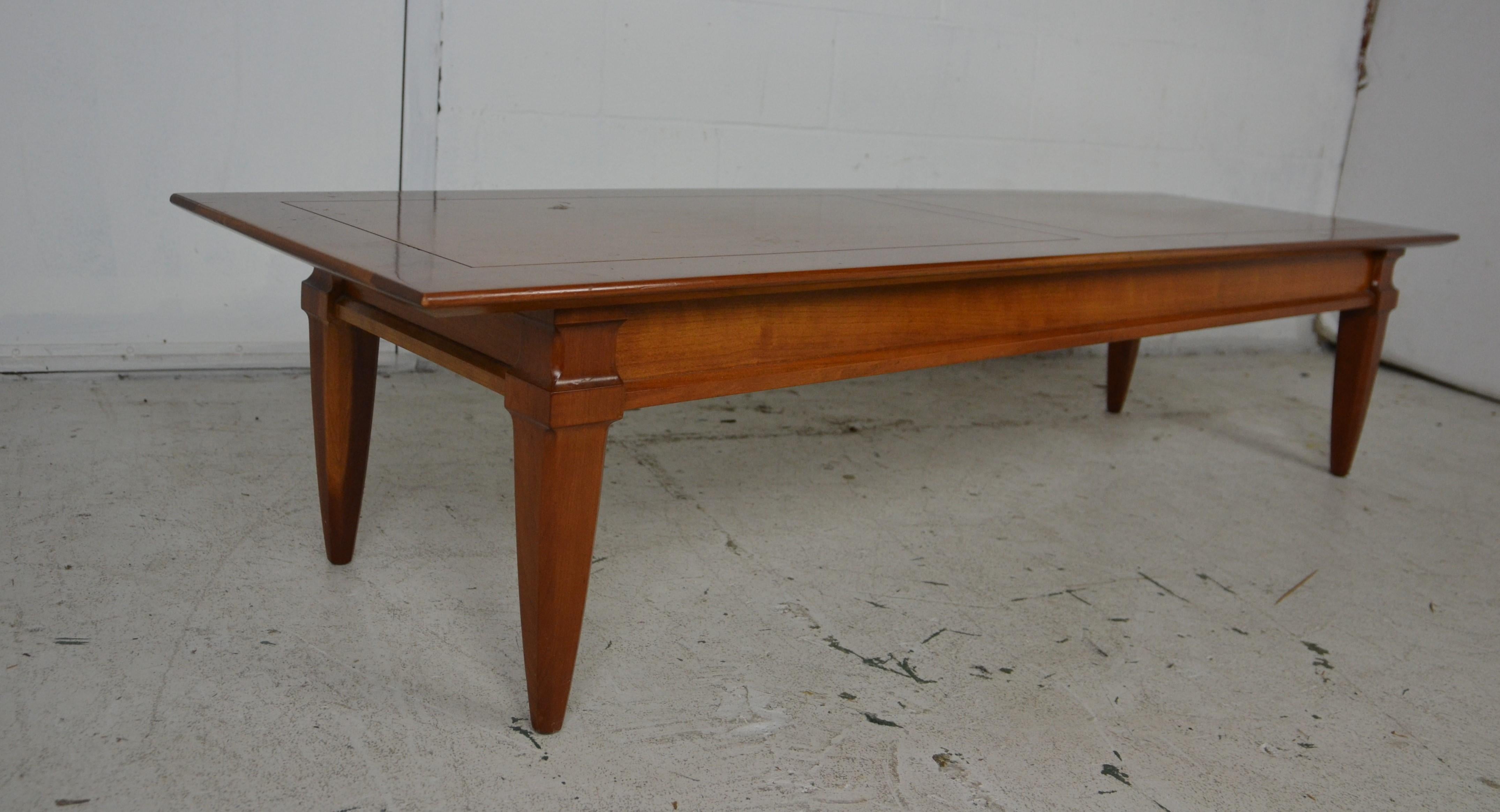 This walnut coffee table is made of solid wood. The natural finish on the wood brings out the beauty of the grain and the true color of the walnut.