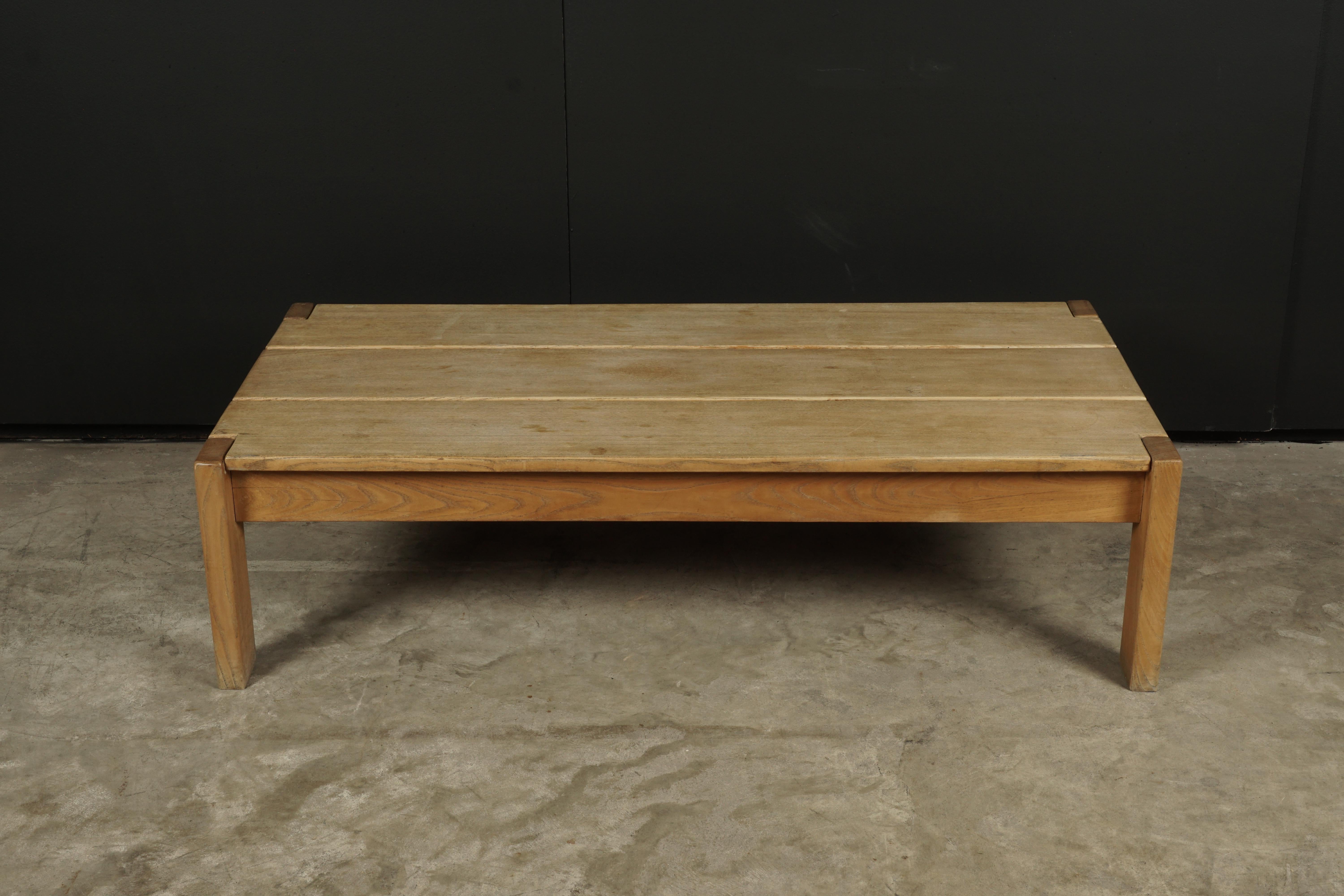 Vintage midcentury coffee table from France, circa 1960. Solid oak construction with light patina and wear.