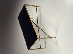 Mid-century coffee table with black glass top