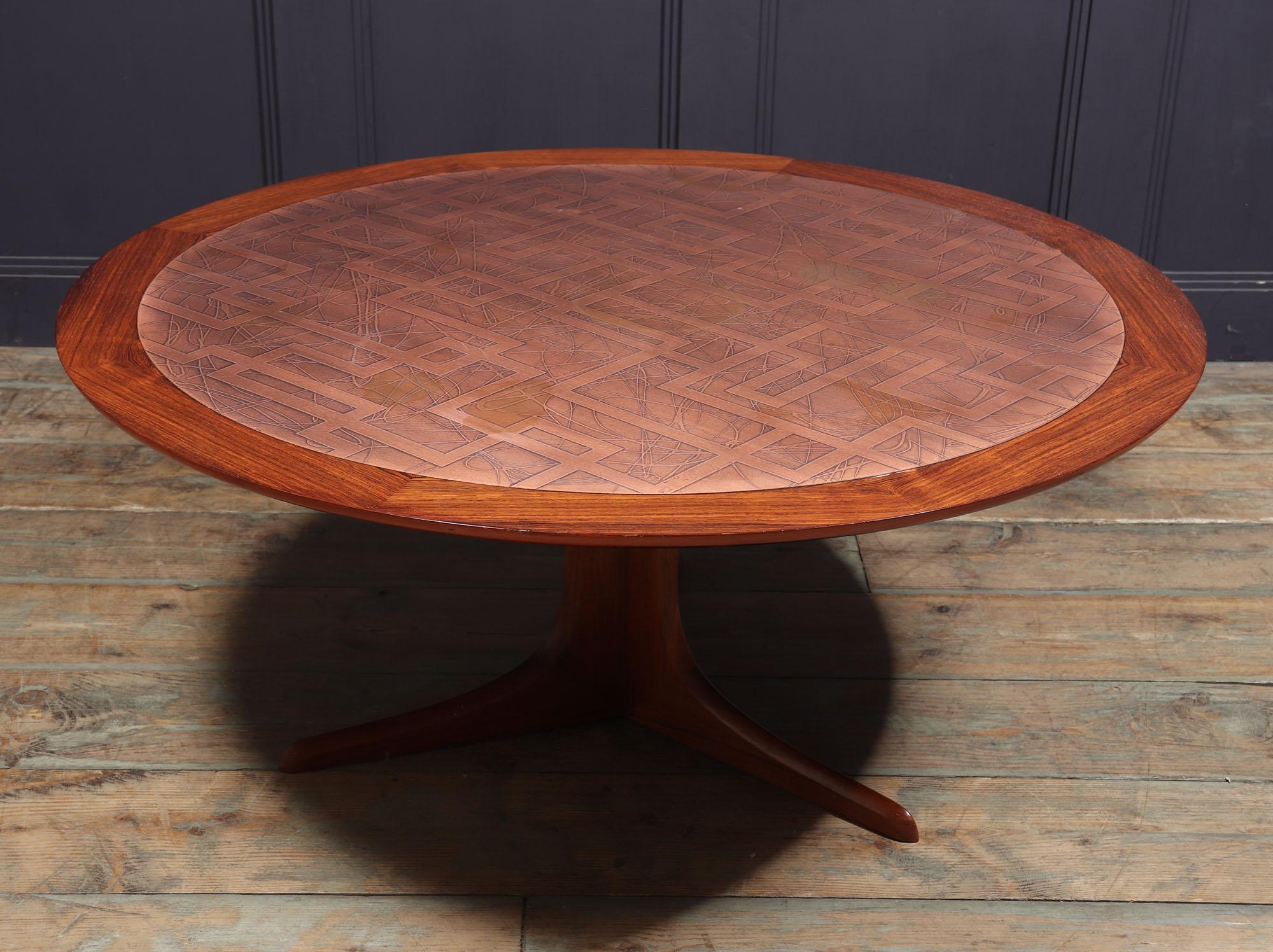 Mid Century circular teak coffee table on tripod base with embossed copper inset top, Scandinavian design from the 1960’s, polished where necessary with patina, there are a few marks to the copper that could not be removed as would change the