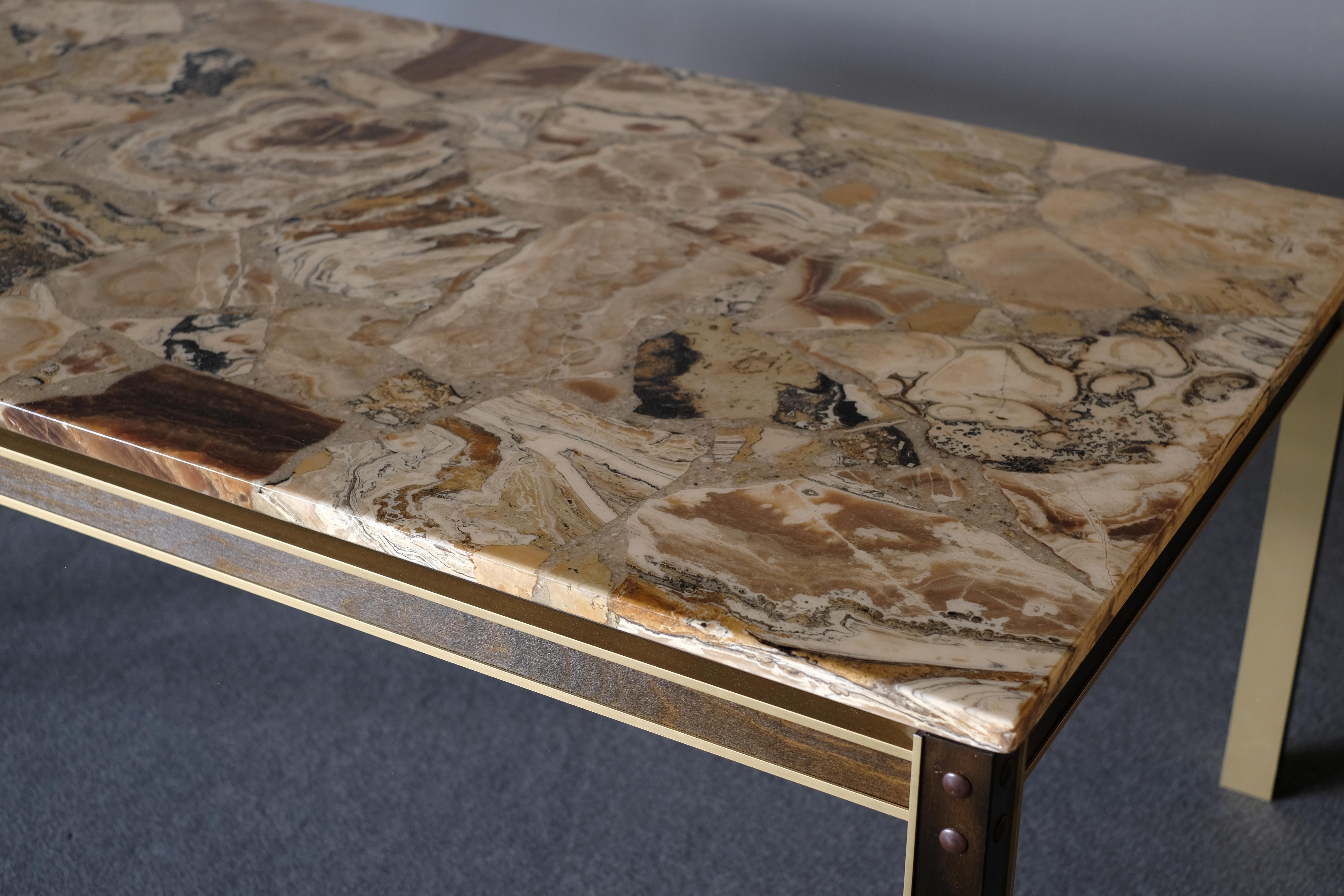 Unique coffee table with brass frame and marble top.