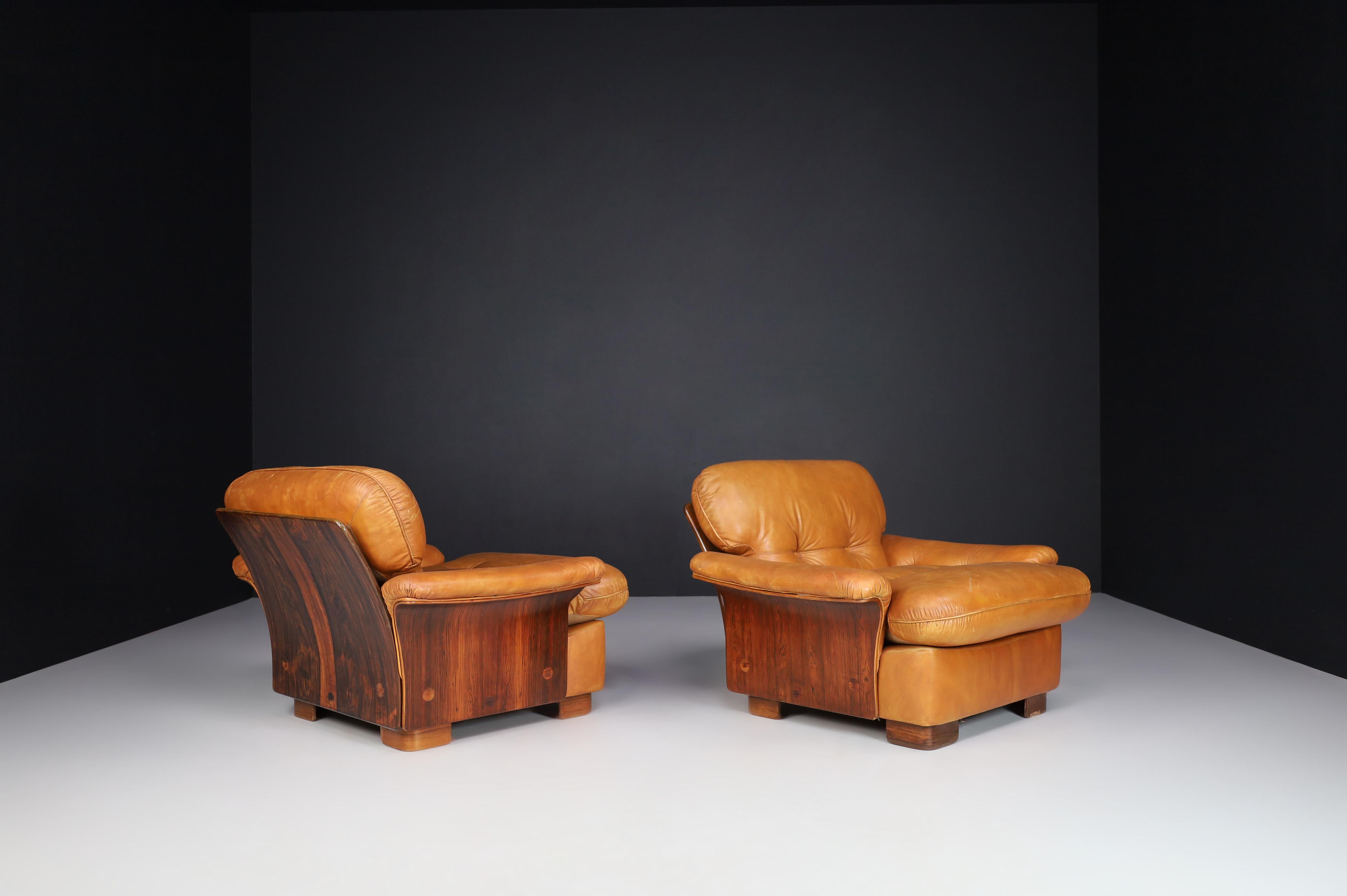 Mid-century cognac leather and bentwood armchairs-lounge chairs, Italy 1960s

Mid-century cognac leather and bentwood armchairs-lounge chairs manufactured and designed in Italy 1960s. It is in lovely vintage condition, with a minor patina on the