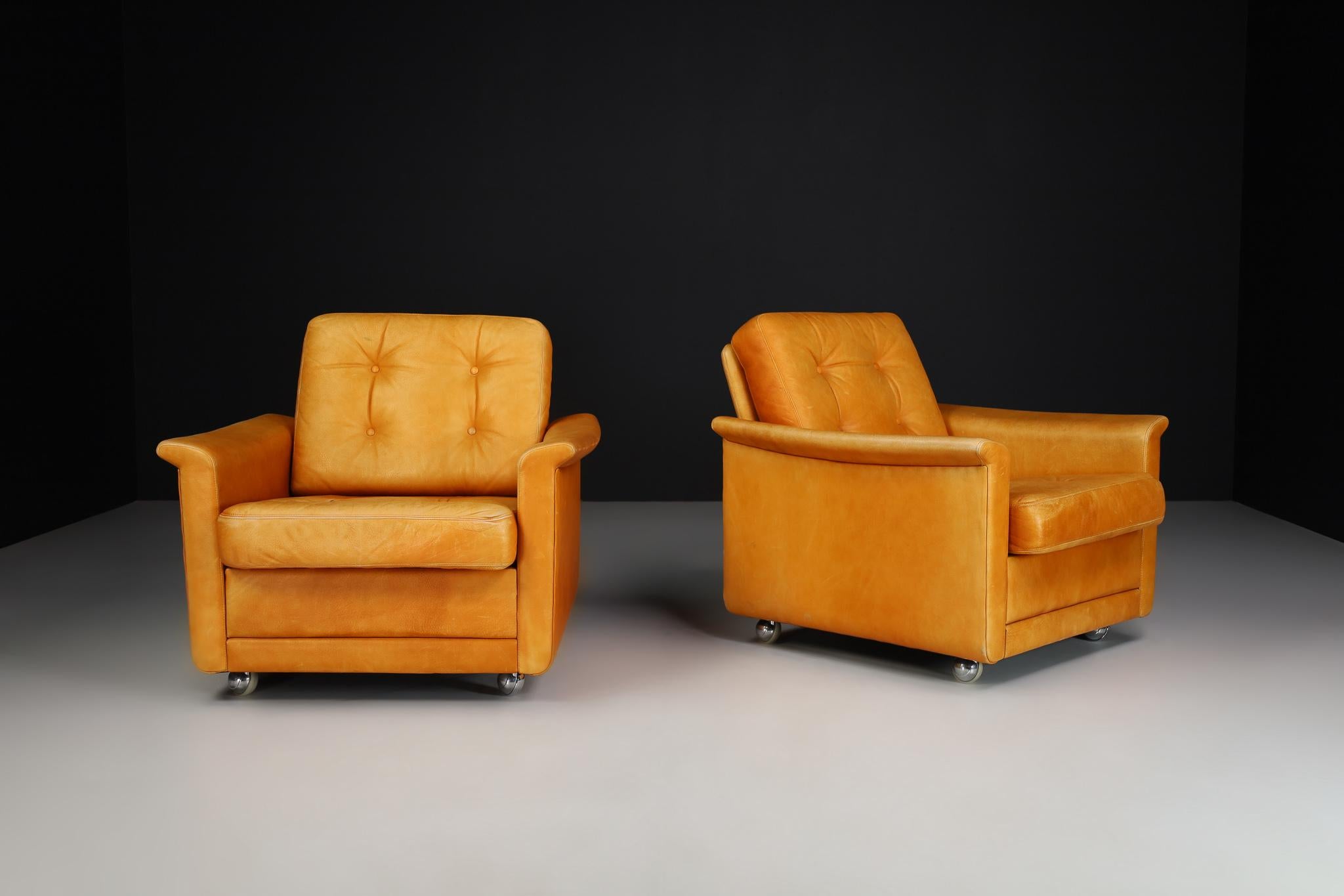Mid-century cognac leather armchairs-lounge chairs, Germany, 1960s.

Mid-century cognac leather armchairs-lounge chairs manufactured and designed in Germany 1960s. It is in lovely vintage condition, with a minor patina on the leather. These