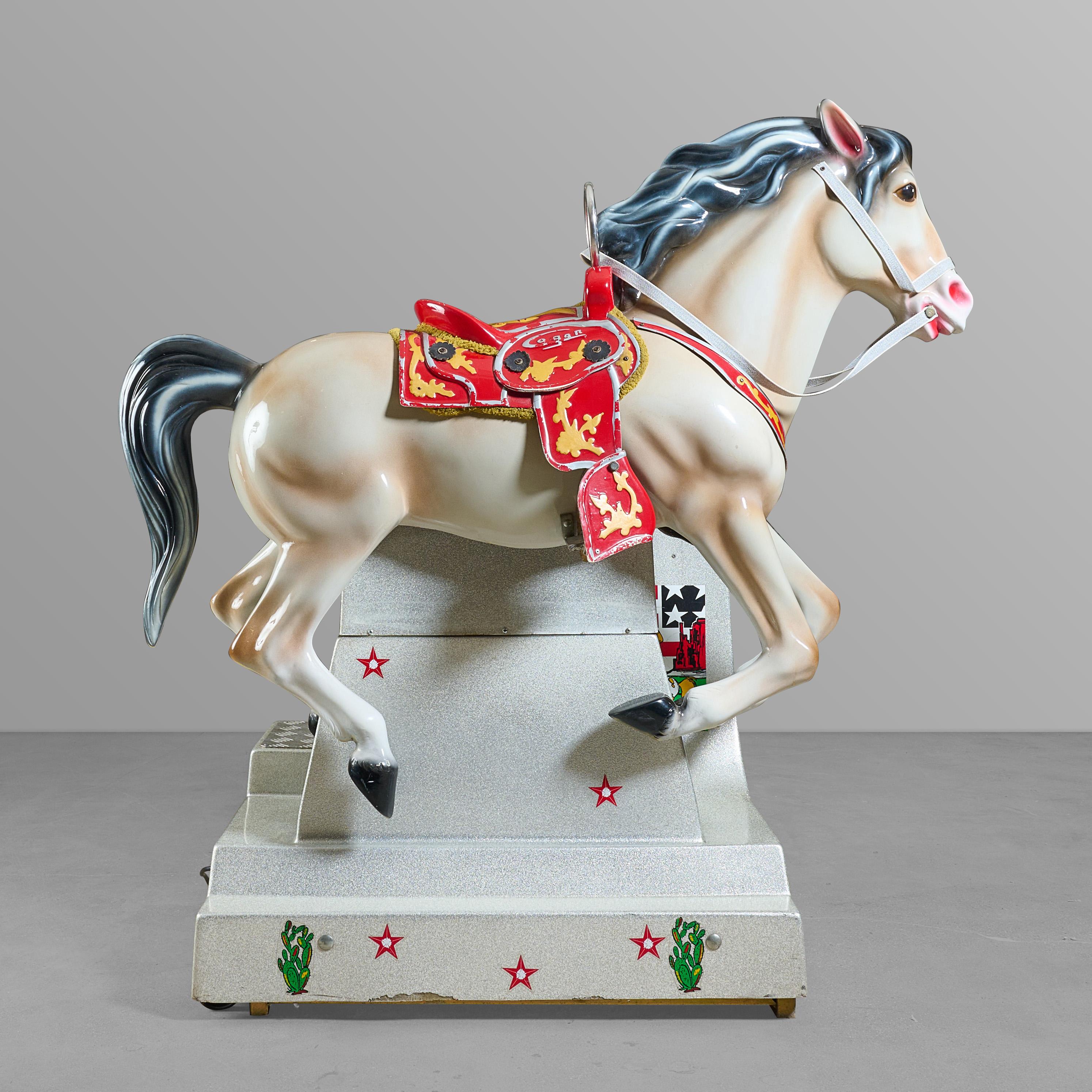 Mid-century coin operated horse ride for kids (of all ages).


